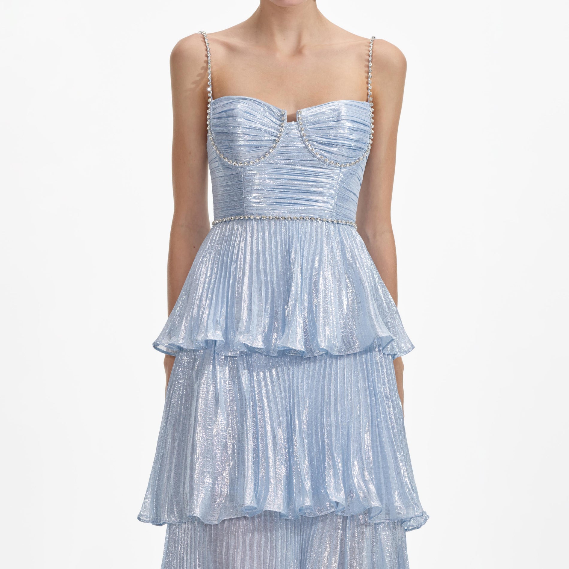 A close up of a woman wearing the Blue Metallic Tiered Midi Dress