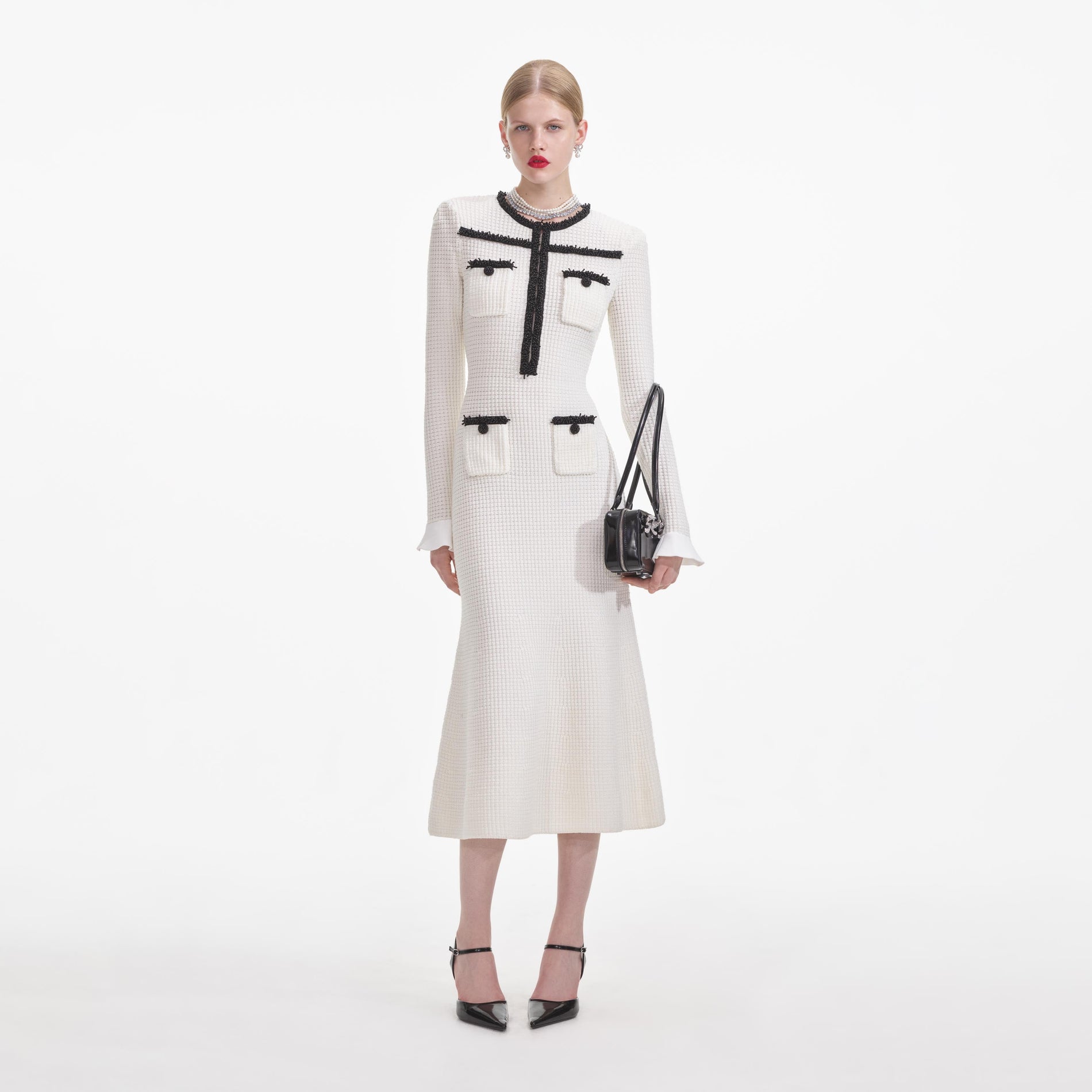 Front view of a woman wearing the White Knit Contrast Trim Midi Dress