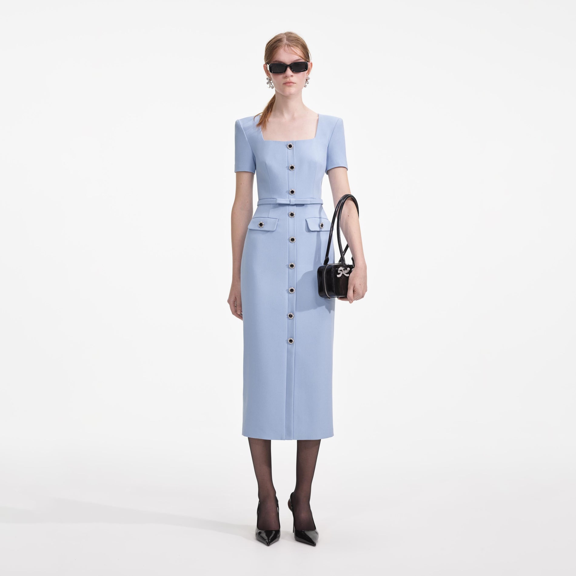 Front view of a woman wearing the Blue Crepe Button Midi Dress