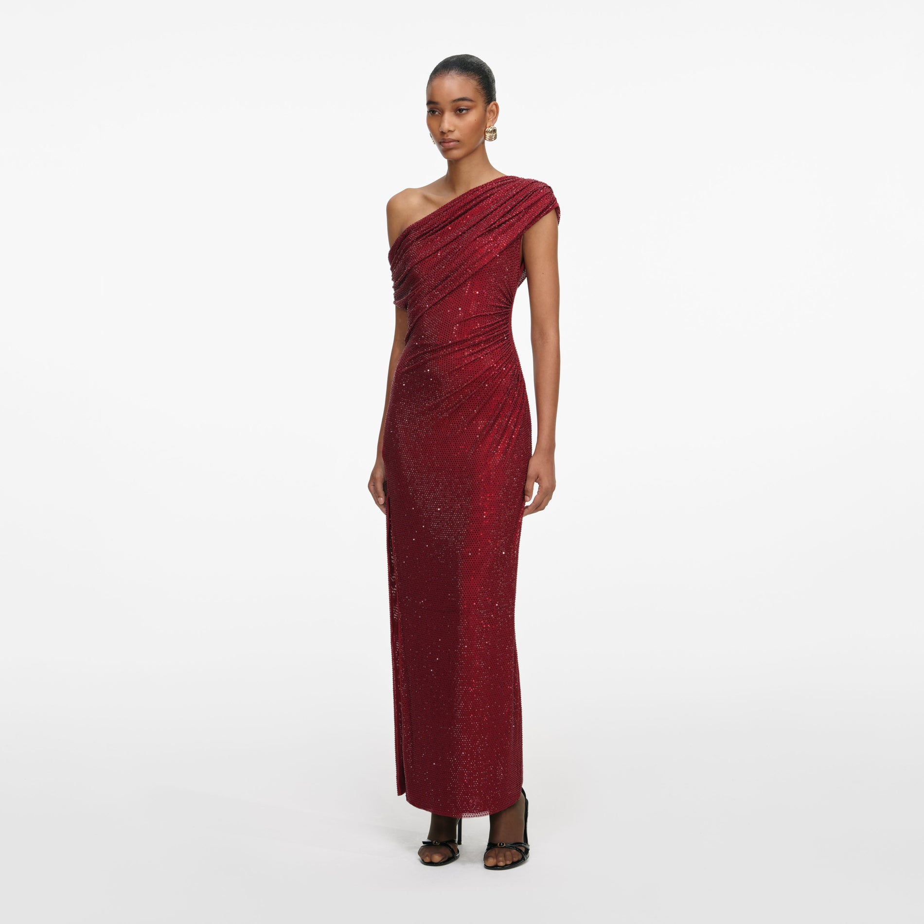 Side view of a woman wearing the Burgundy Rhinestone Drape Midi Dress