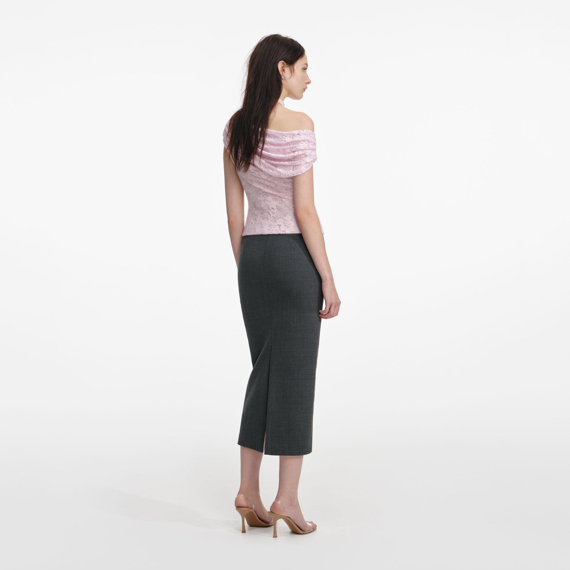 Back view of a woman wearing the Pink Rhinestone Lace Drape Top