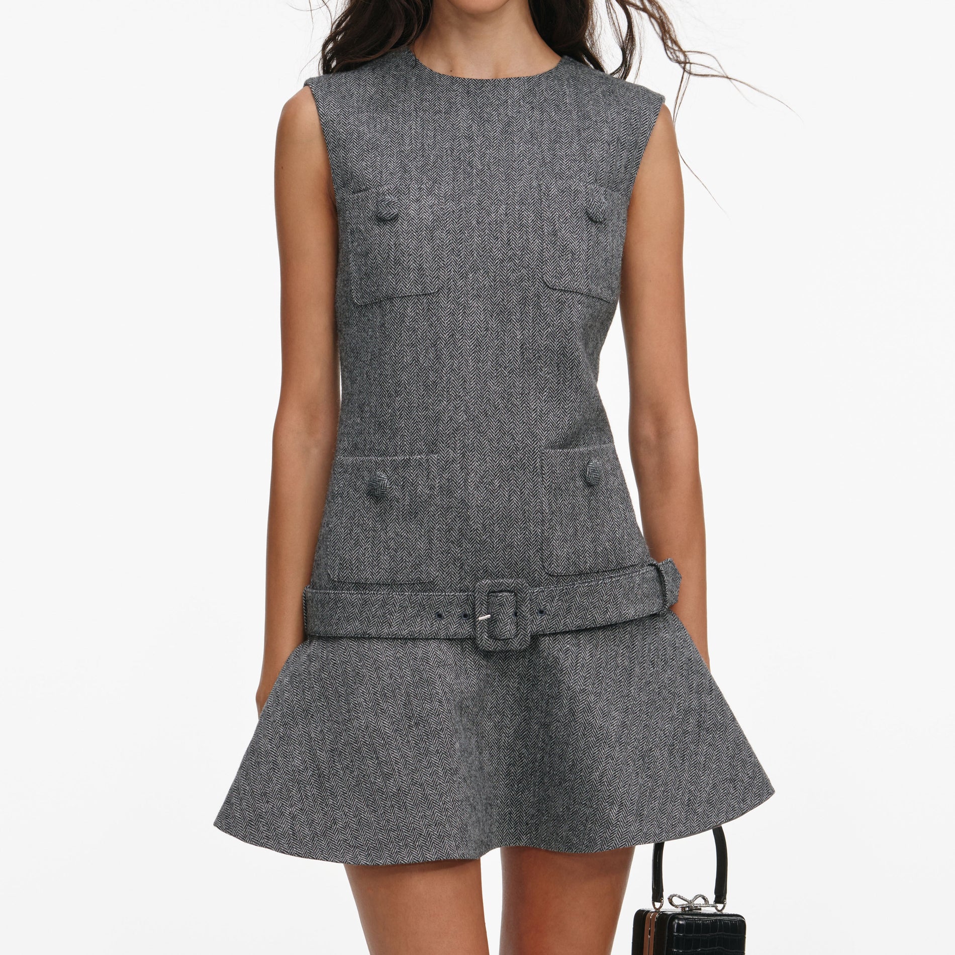 A close up of a woman wearing the Grey Herringbone Flared Mini Dress