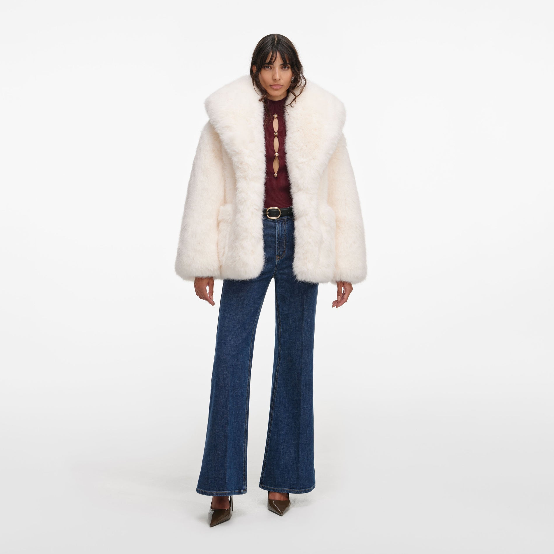 Front view of a woman wearing the White Faux Fur Coat