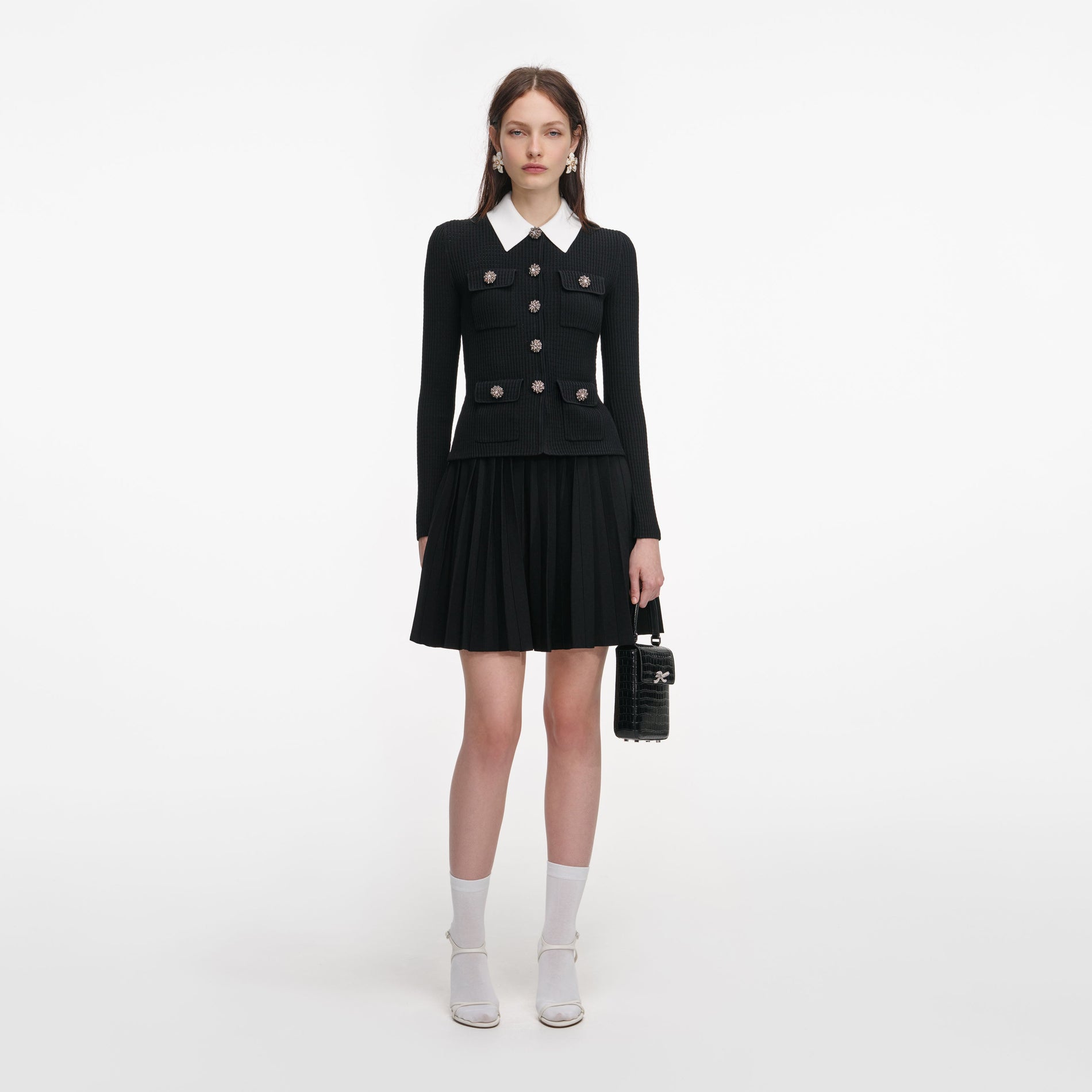 Front view of a woman wearing the Black Tailored Knit Mini Dress