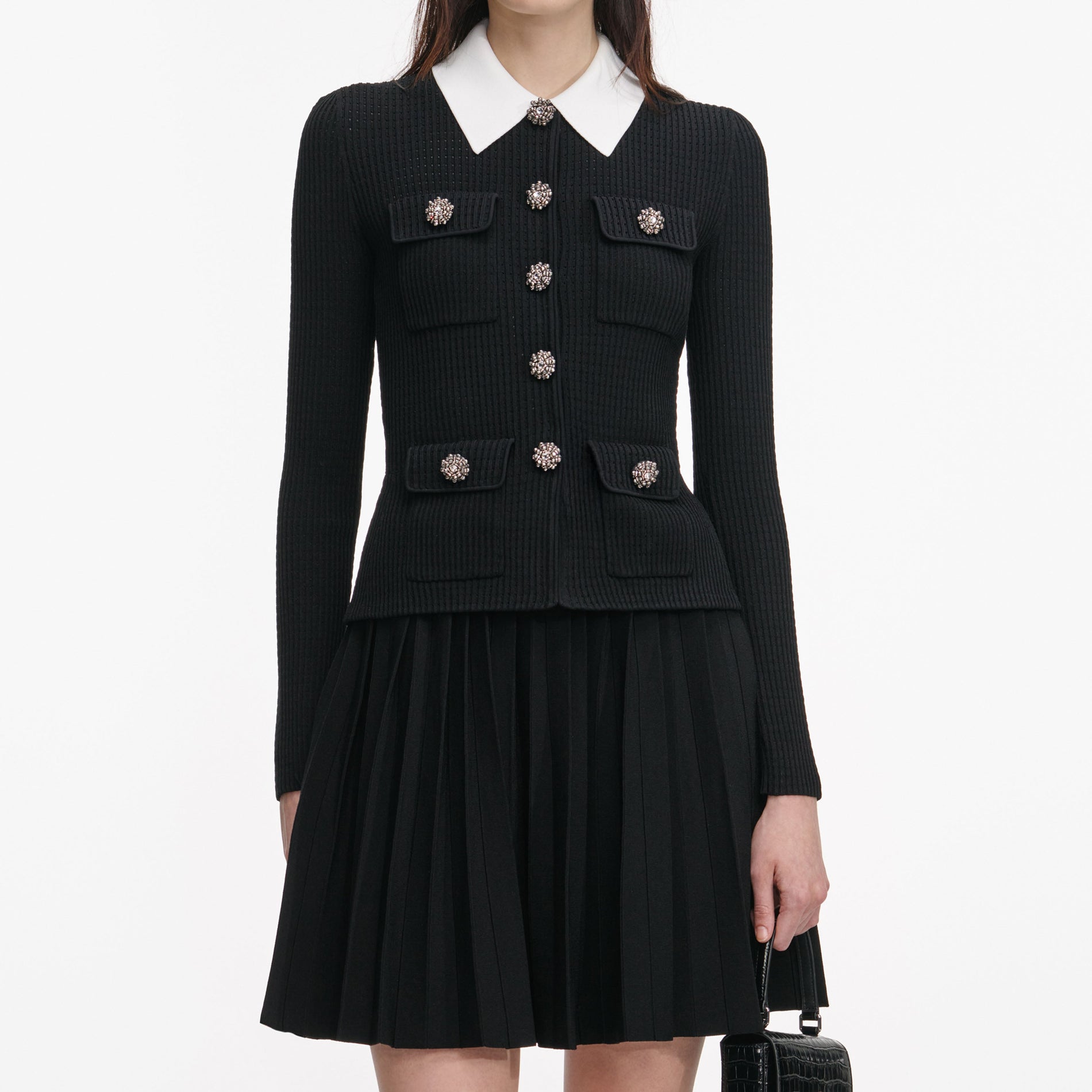A close up of a woman wearing the Black Tailored Knit Mini Dress