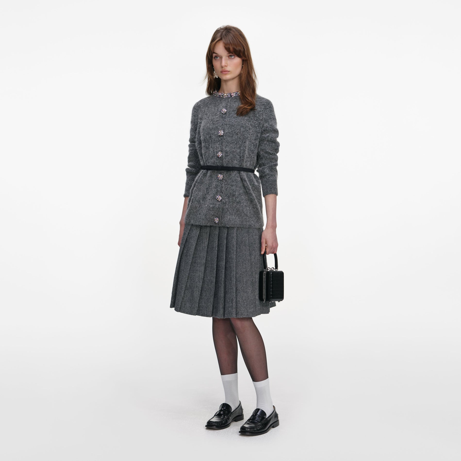 Side view of a woman wearing the Charcoal Crystal Trim Cardigan