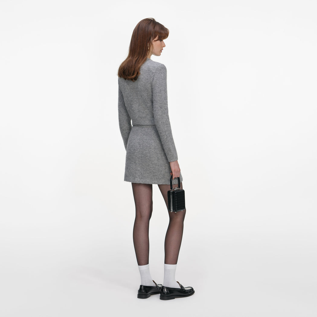 Back view of a woman wearing the Grey Fluffy Crystal Trim Cardigan