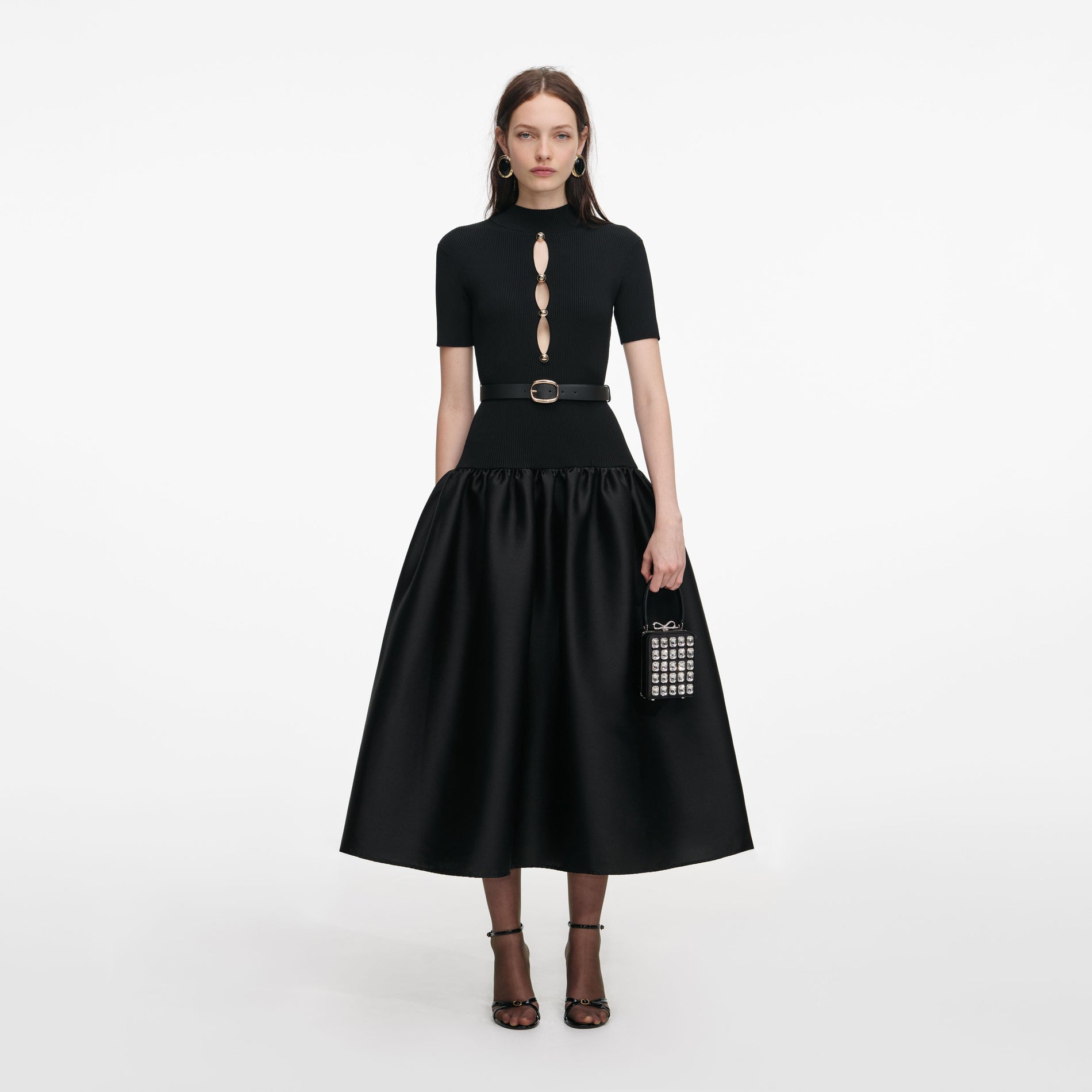 Front view of a woman wearing the Black Knit Taffeta Midi Dress