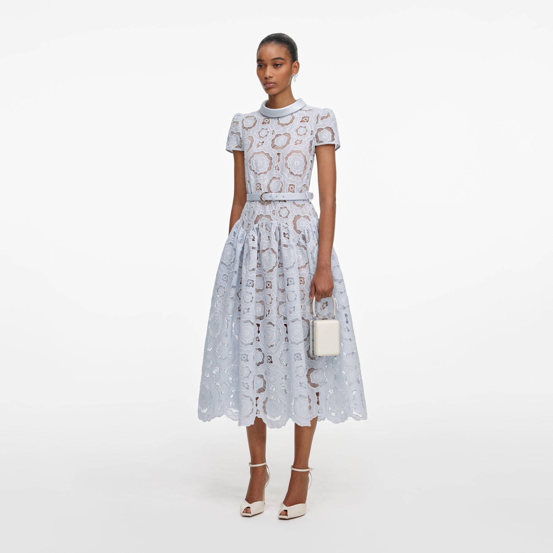 Side view of a woman wearing the Blue Floral Lace  Midi Dress