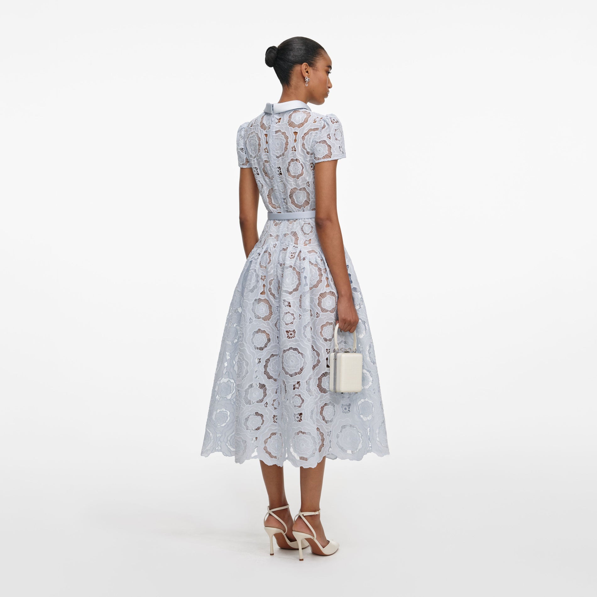 Back view of a woman wearing the Blue Floral Lace  Midi Dress