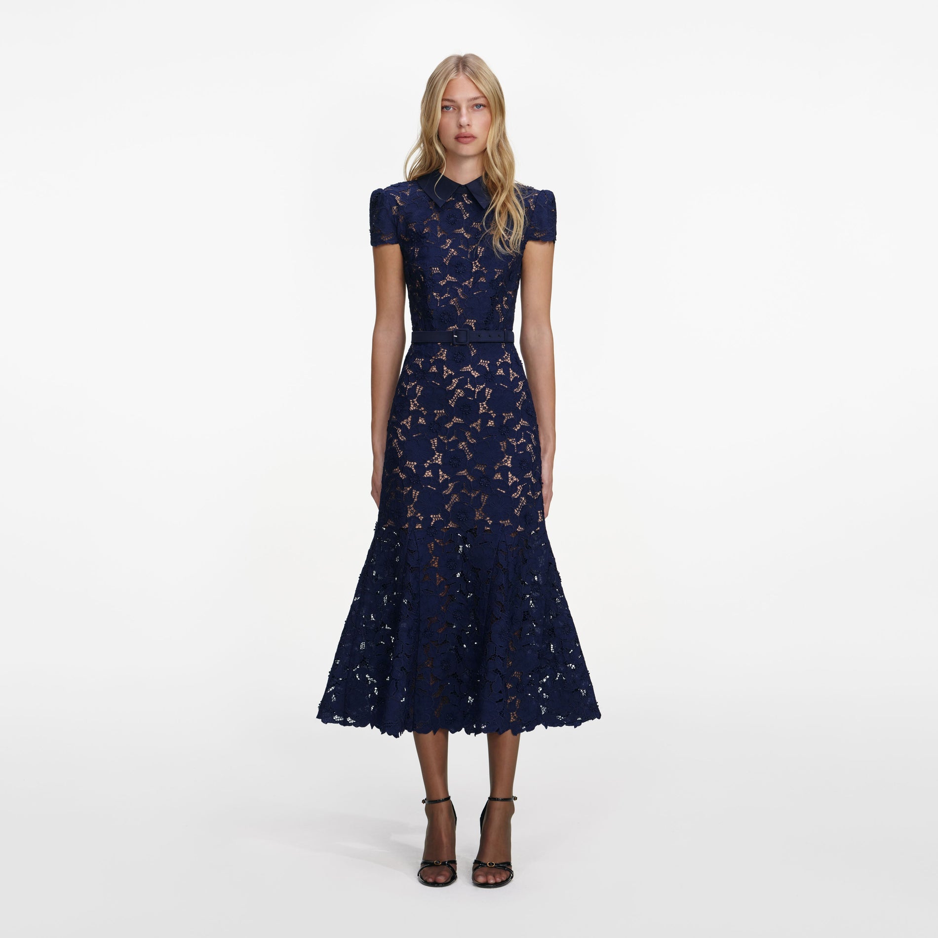 Front view of a woman wearing the Navy Guipure Lace Midi Dress