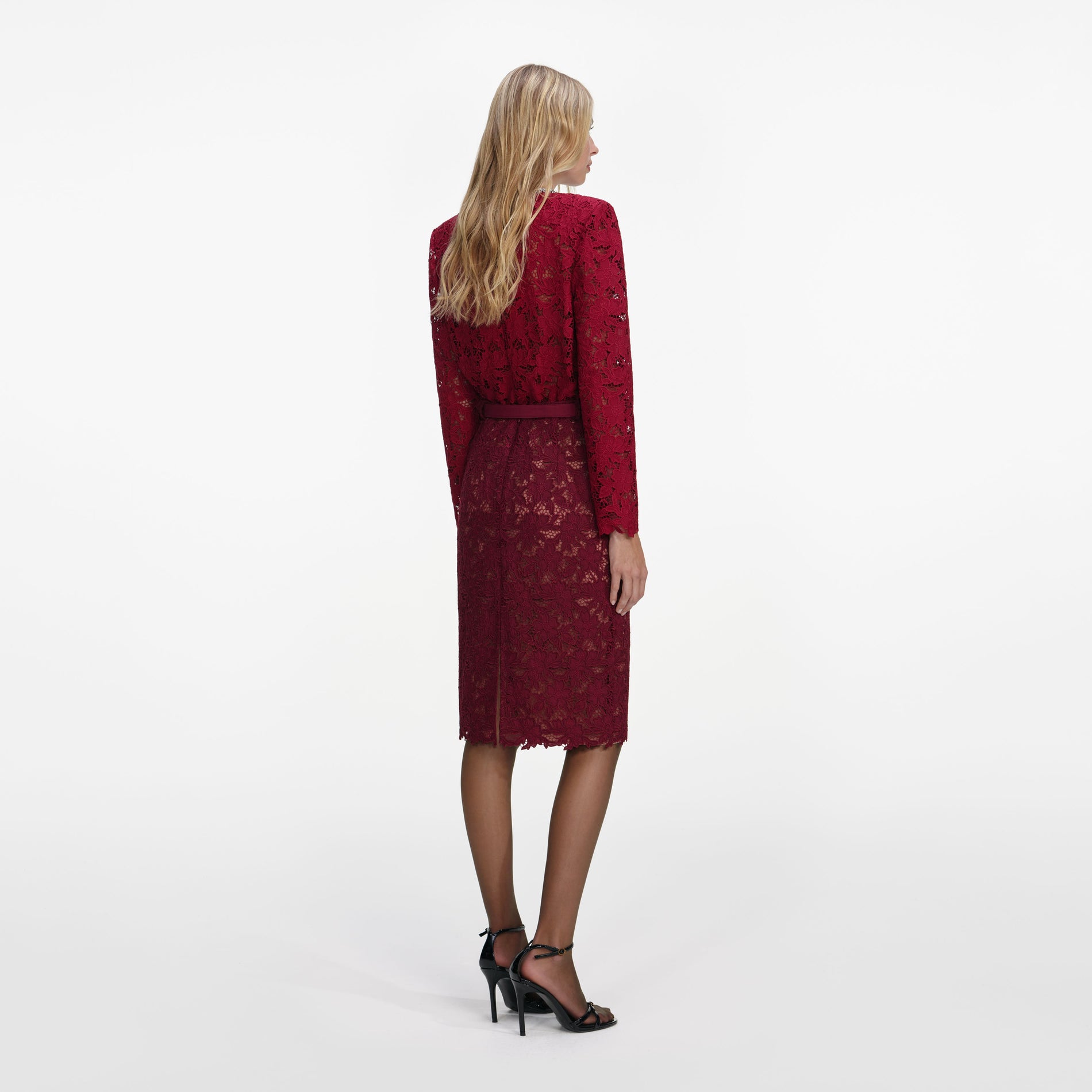 Back view of a woman wearing the Burgundy Guipure Lace Midi Skirt
