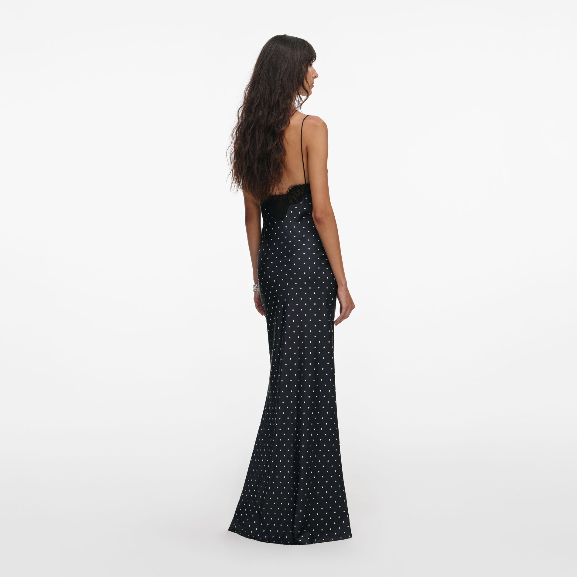 Back view of a woman wearing the Polka Dot Satin Lace Maxi Dress