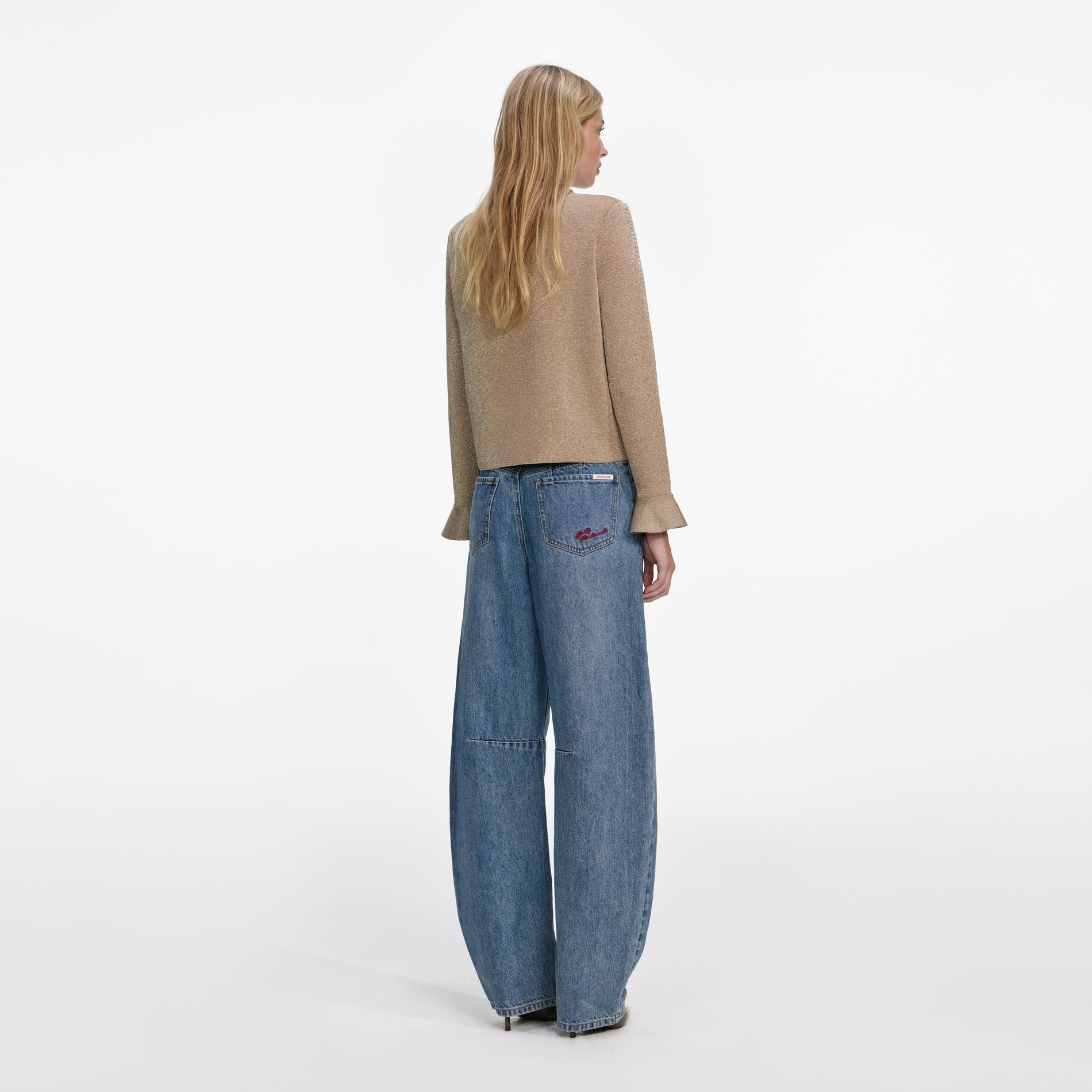 Back view of a woman wearing the Gold Crystal Trim Cardigan