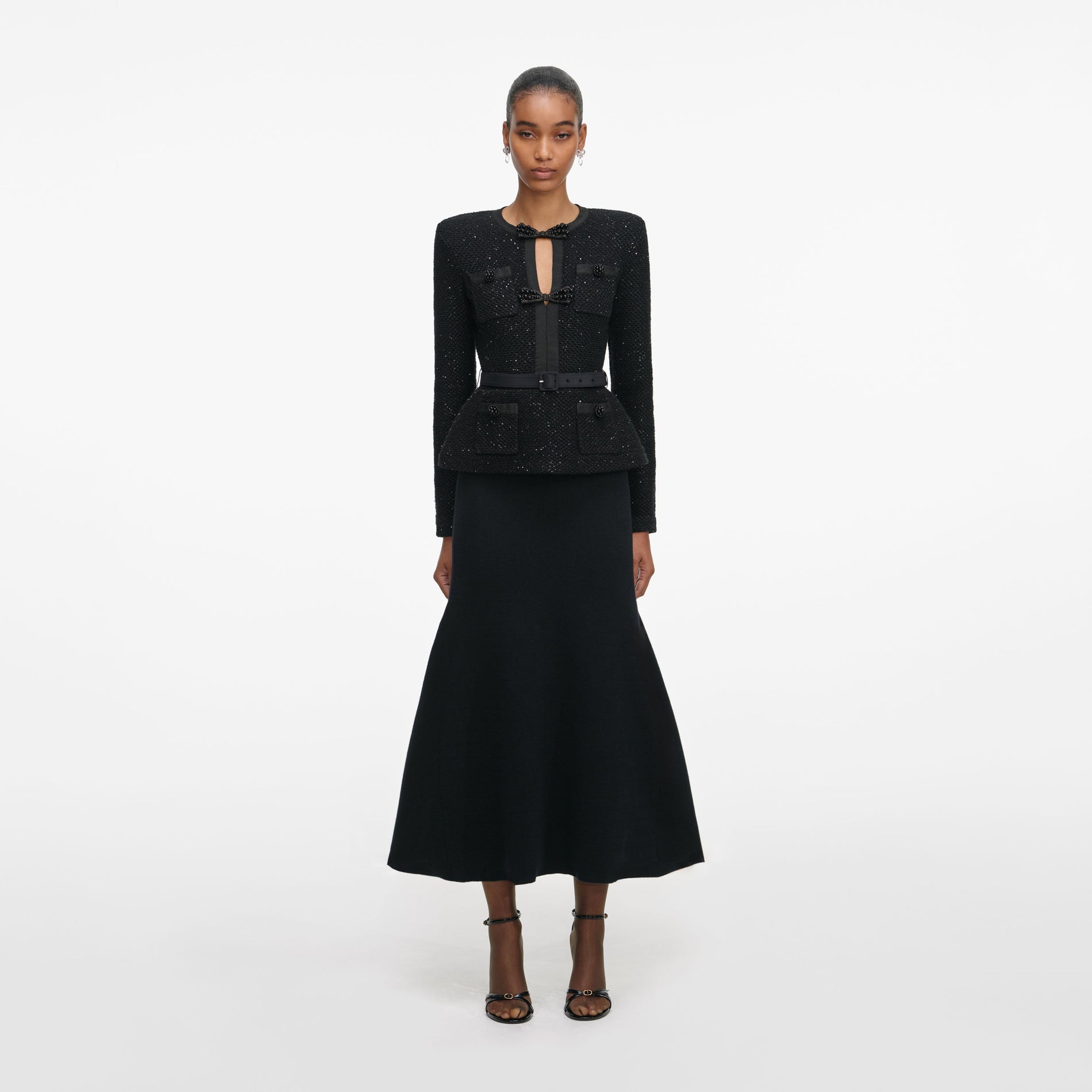 Front view of a woman wearing the Black Sequin Knit Tailored Midi Dress