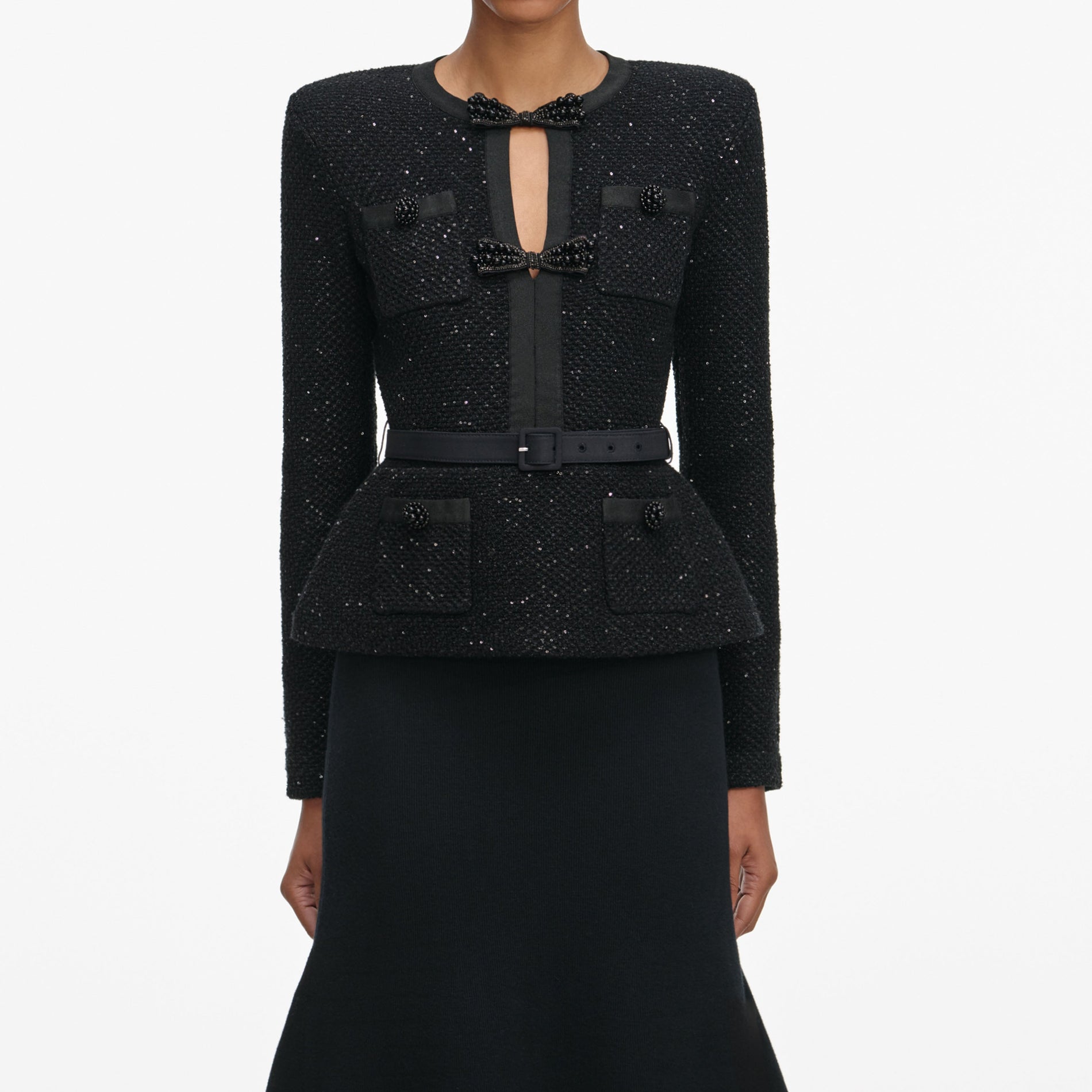 A close up of a woman wearing the Black Sequin Knit Tailored Midi Dress