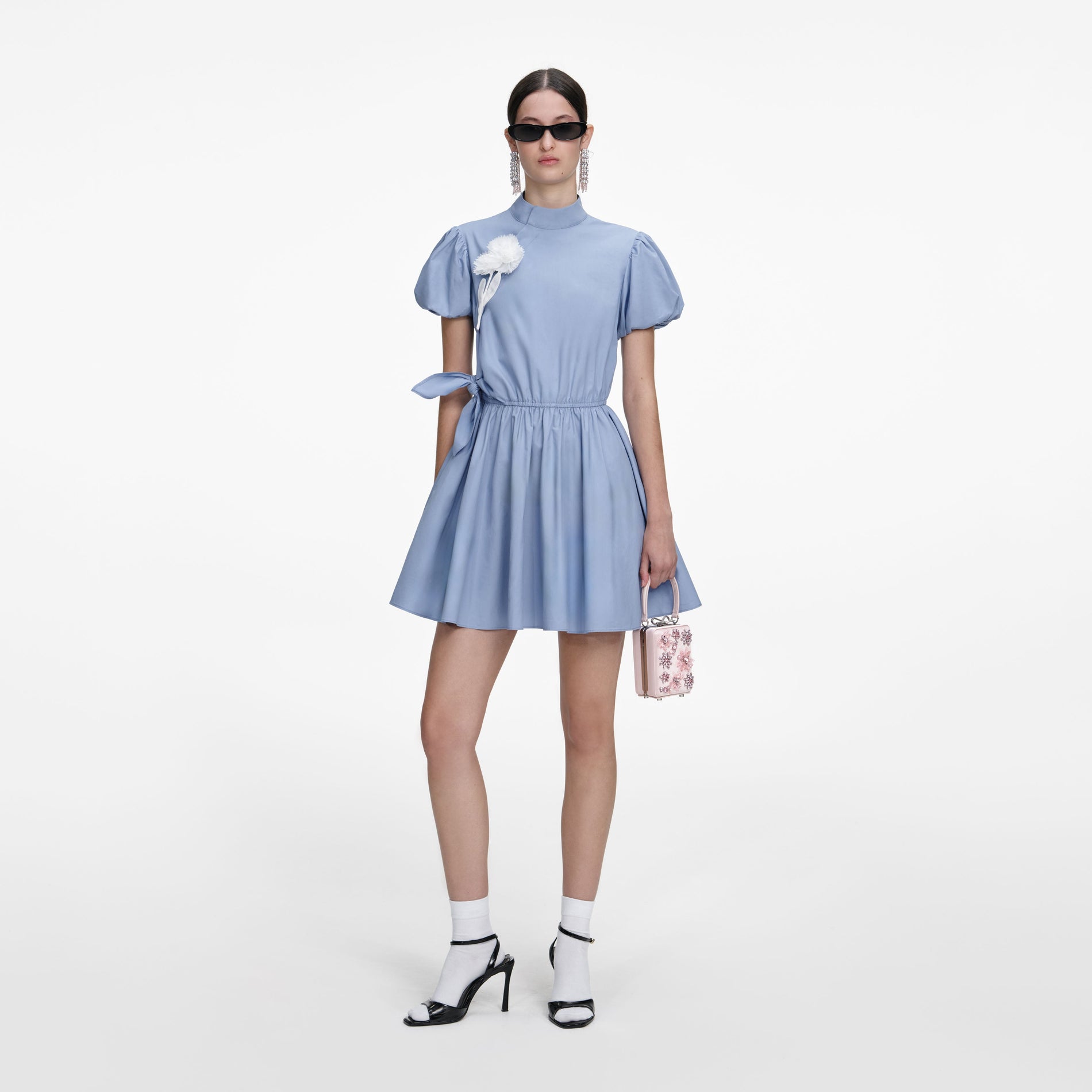 Front view of a woman wearing the Blue Cotton Drape Mini Dress