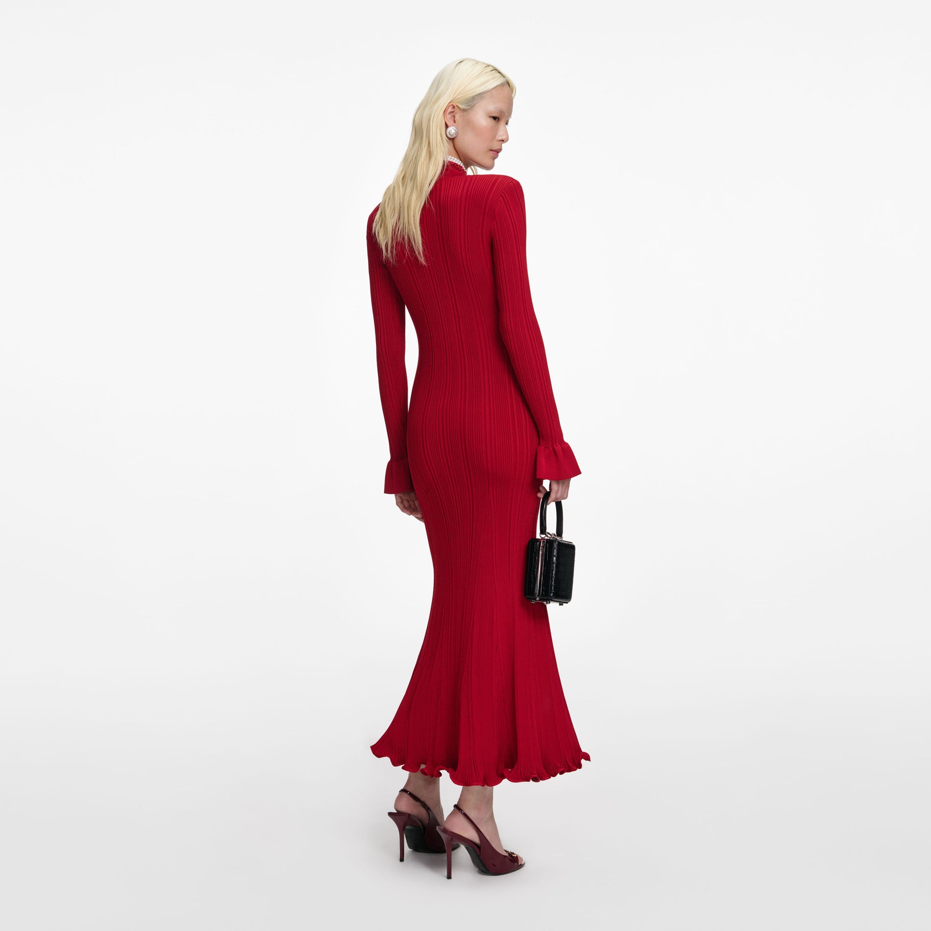 Back view of a woman wearing the Red Pearl Trim Knit Midi Dress