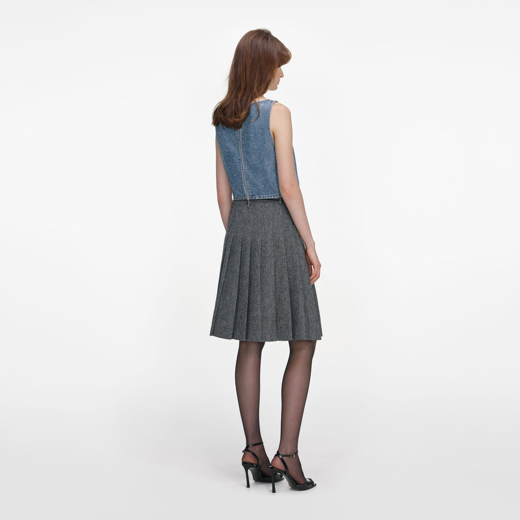 Back view of a woman wearing the Rhinestone Denim Crop Top