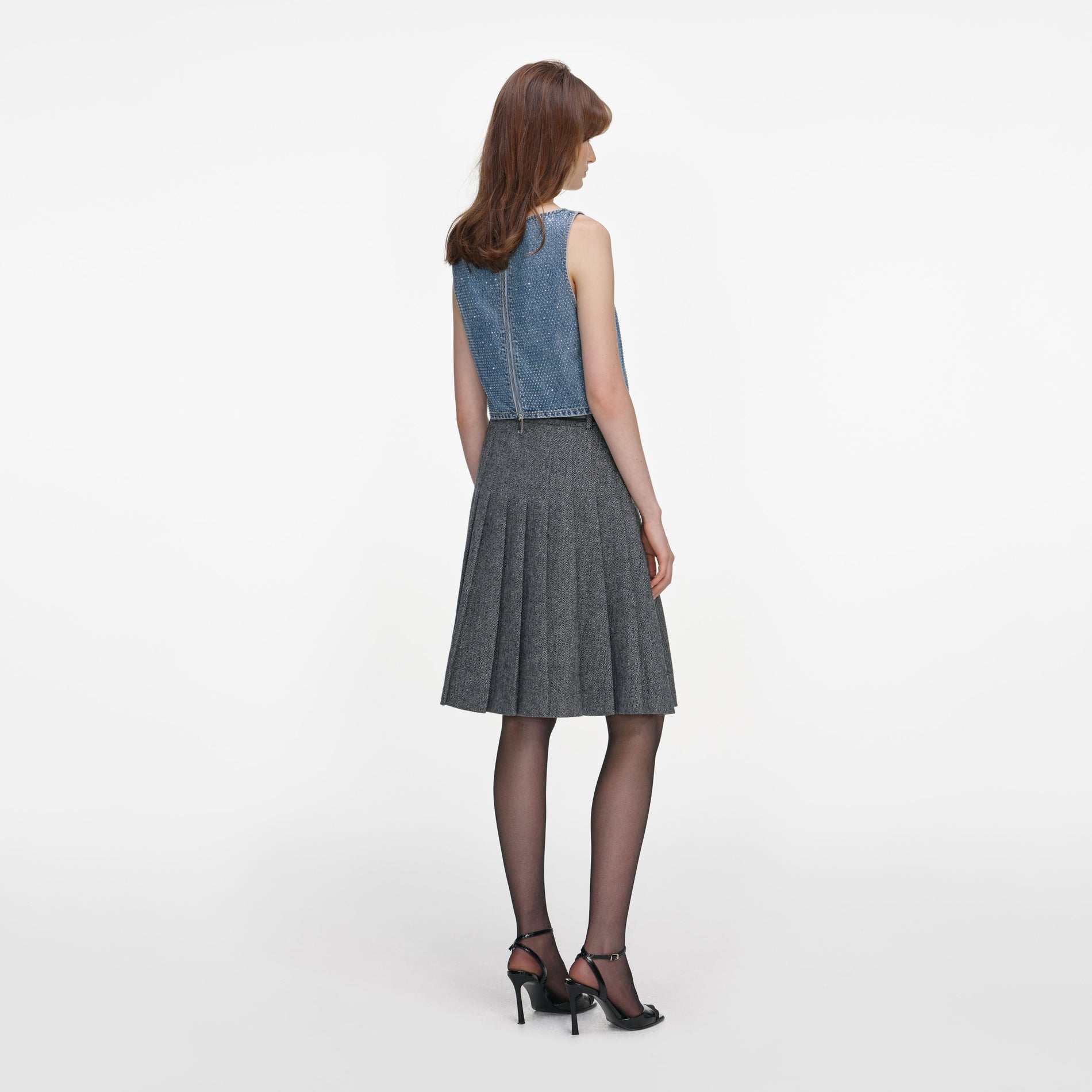 Back view of a woman wearing the Rhinestone Denim Crop Top