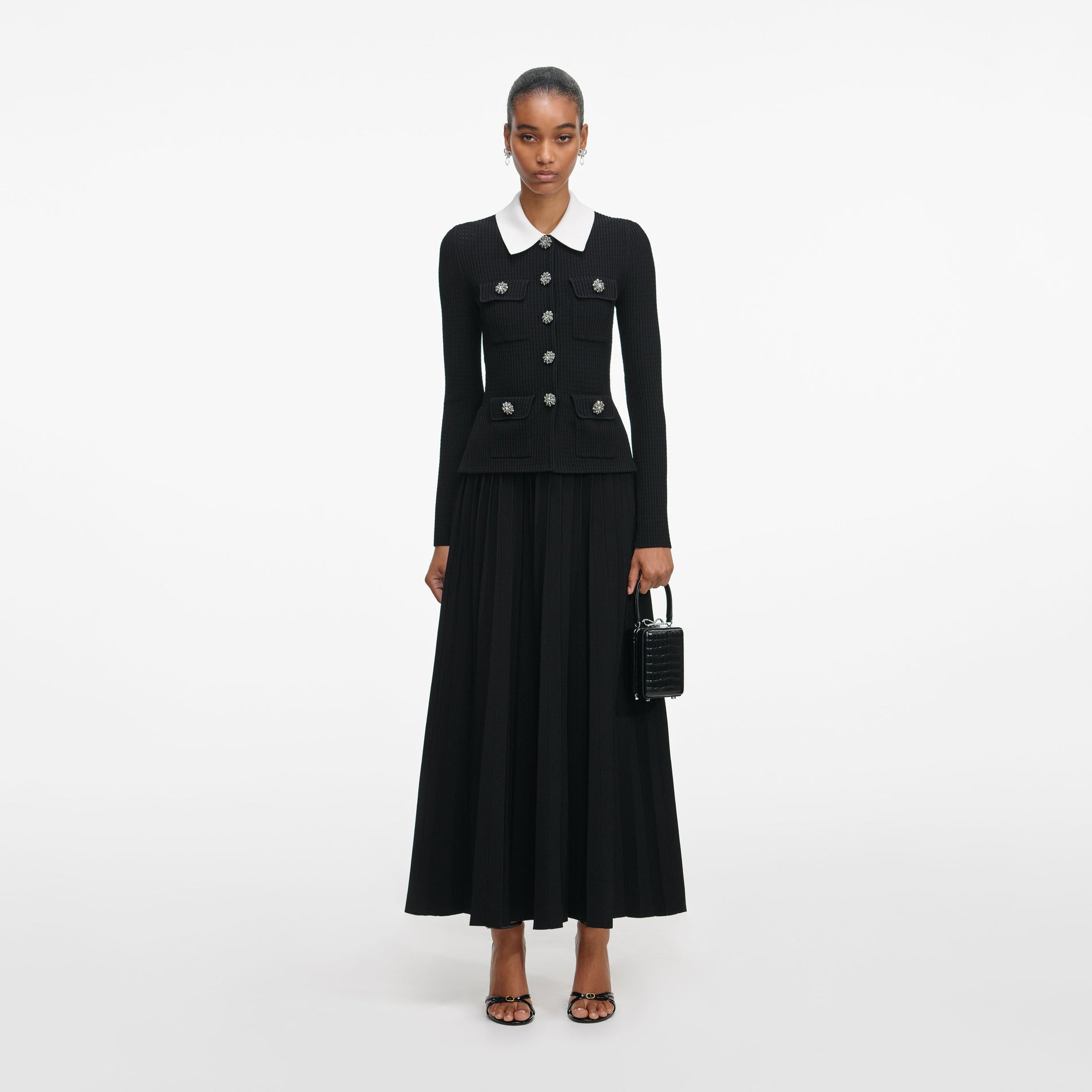 Front view of a woman wearing the Black Tailored Knit Midi Dress