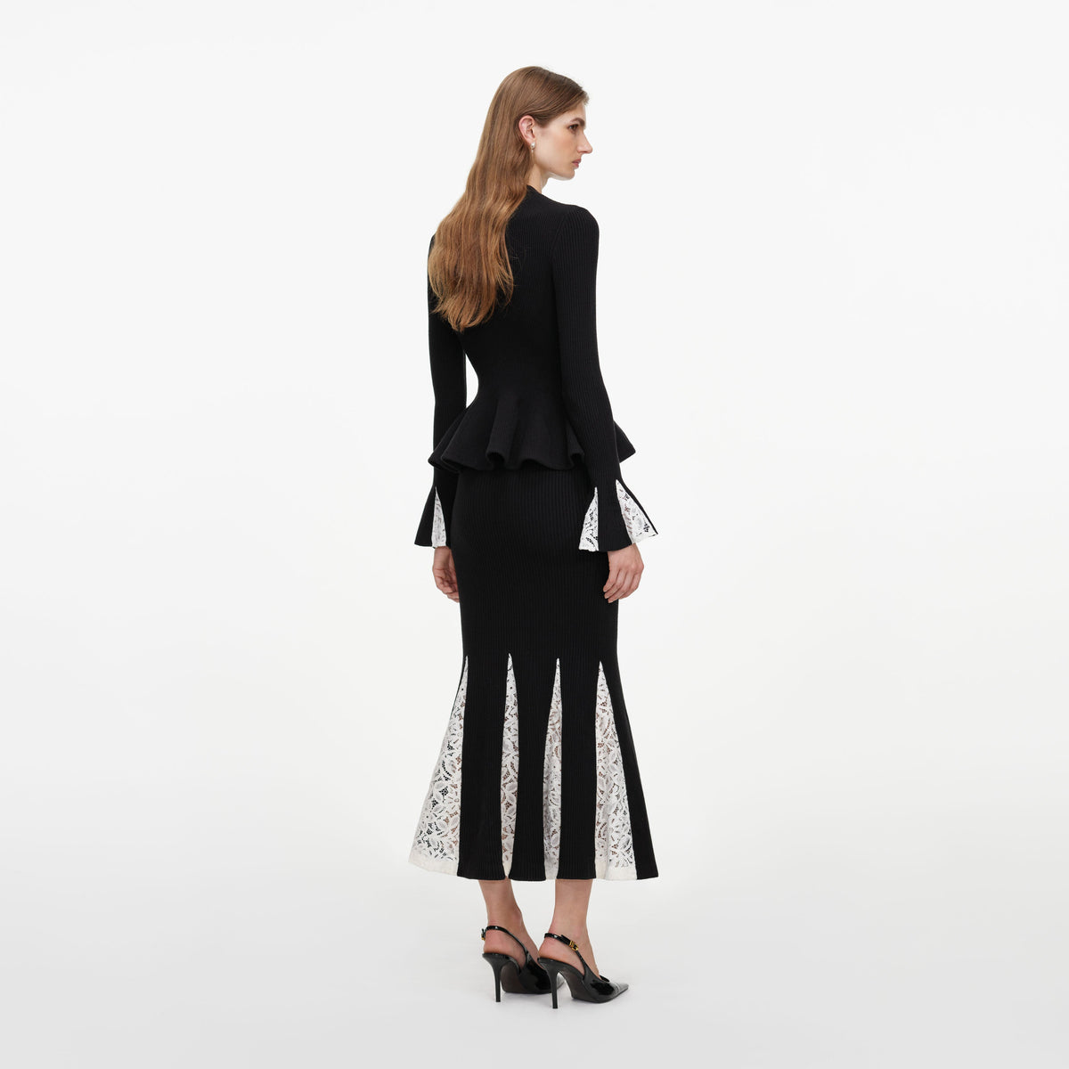 Back view of a woman wearing the Black Lace Insert Knit Midi Dress