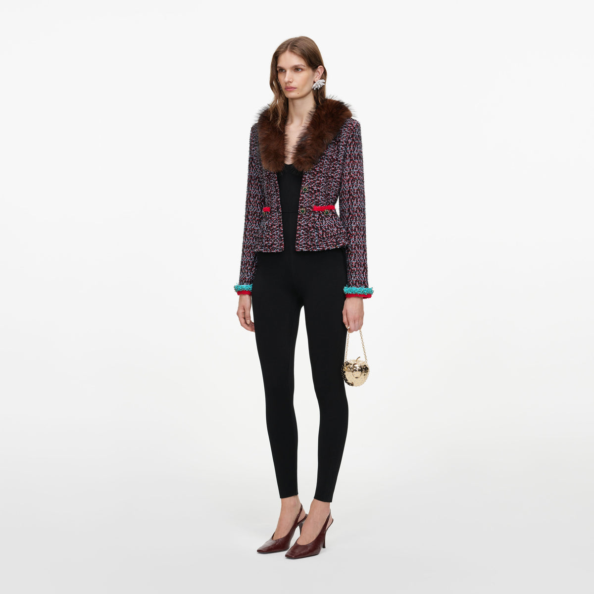 Side view of a woman wearing the Multi Textured Knit Peplum Cardigan
