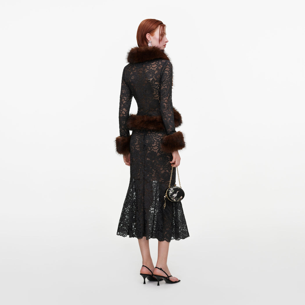 Back view of a woman wearing the Grey Lace Midi Skirt