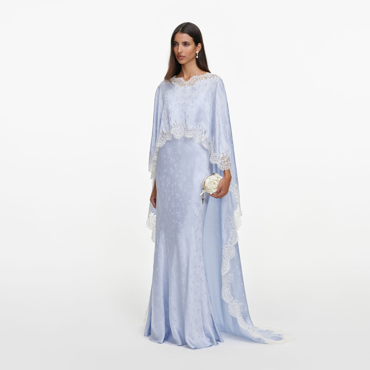 Side view of a woman wearing the Blue Satin Lace Cape Maxi Dress