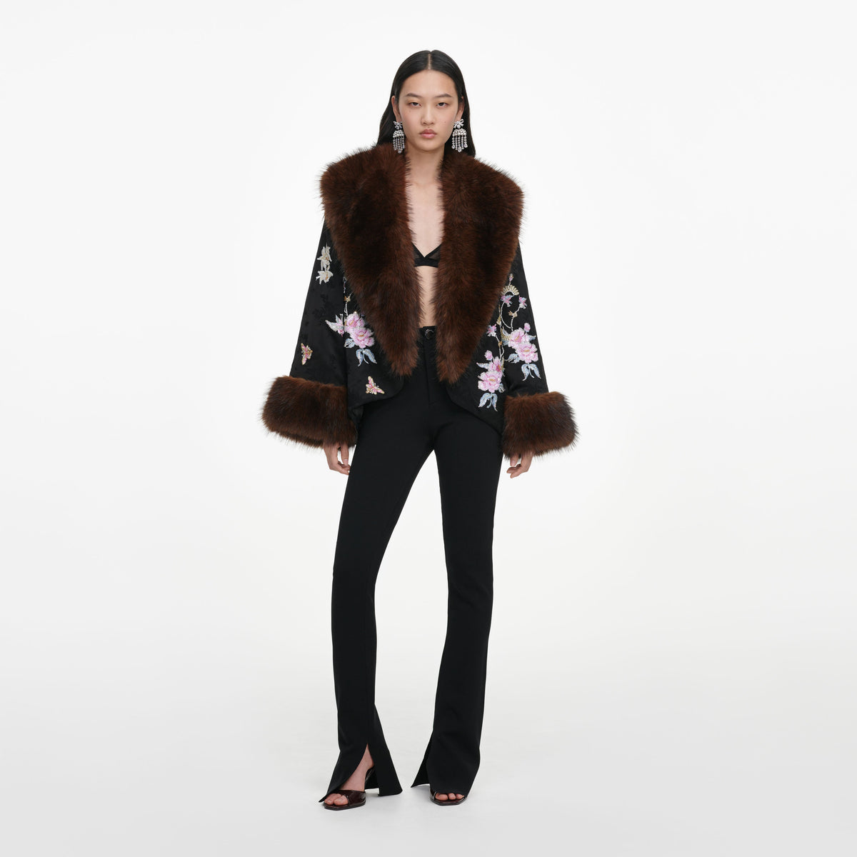 Front view of a woman wearing the Black Floral Jacquard Fur Collar Coat