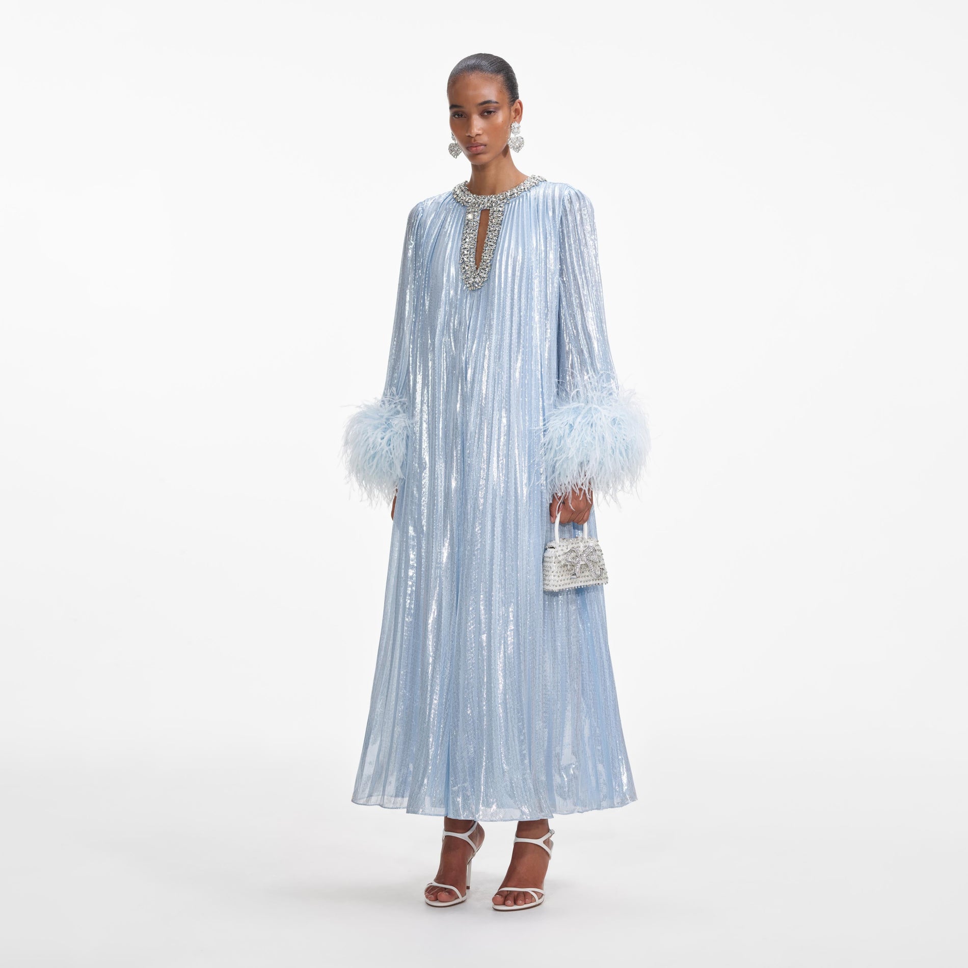 Side view of a woman wearing the Blue Metallic Chiffon Feather Midi Dress