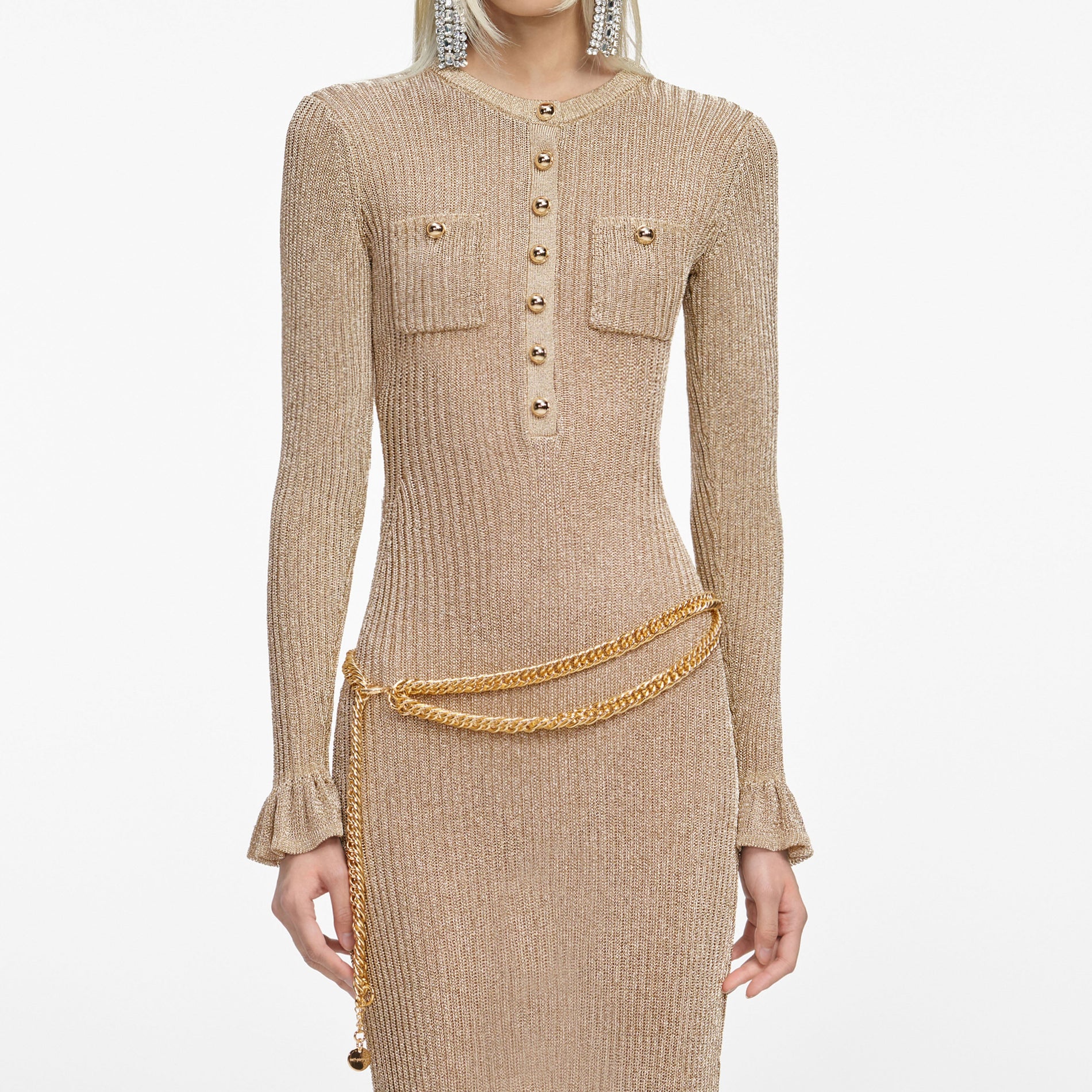 A close up of a woman wearing the Gold Lurex Ribbed Knit Midi Dress