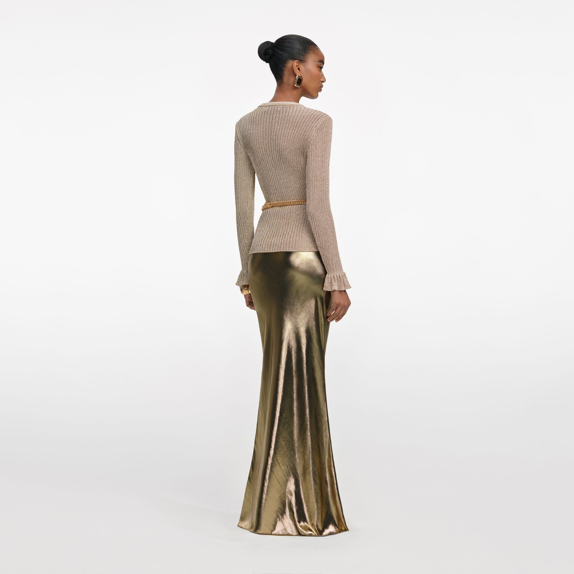 Back view of a woman wearing the Gold Metallic Maxi Skirt