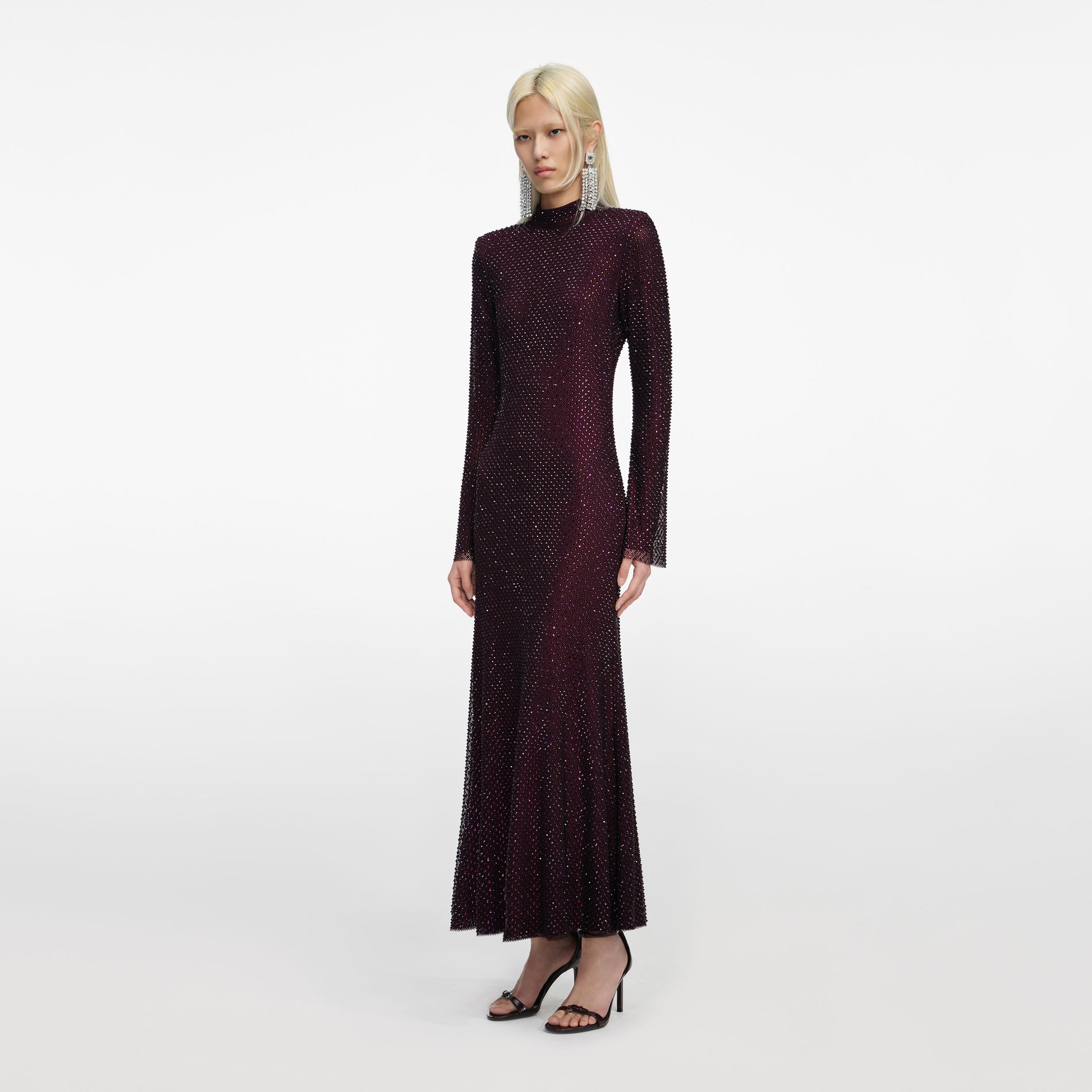 Side view of a woman wearing the Burgundy Rhinestone Fishnet Midi Dress