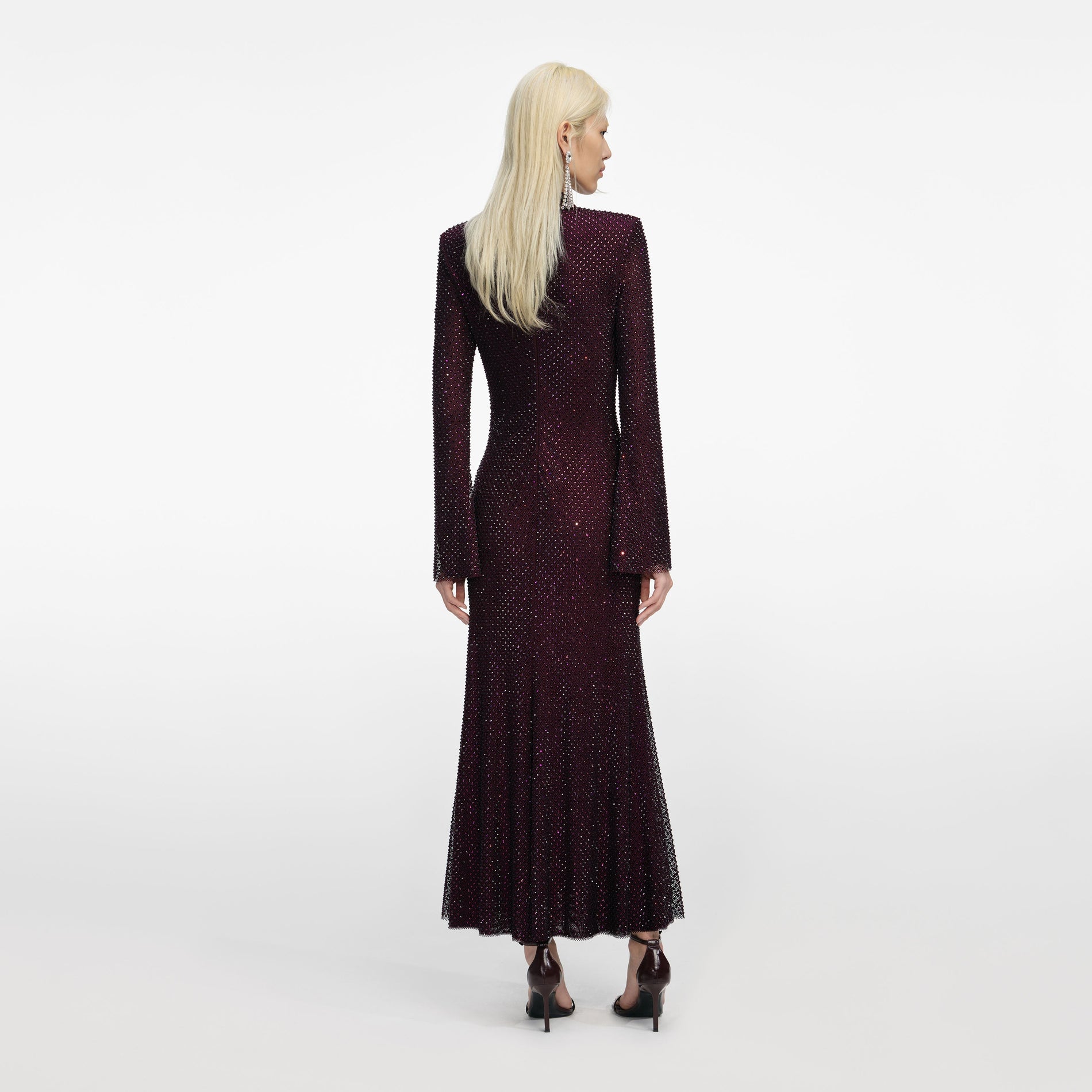 Back view of a woman wearing the Burgundy Rhinestone Fishnet Midi Dress