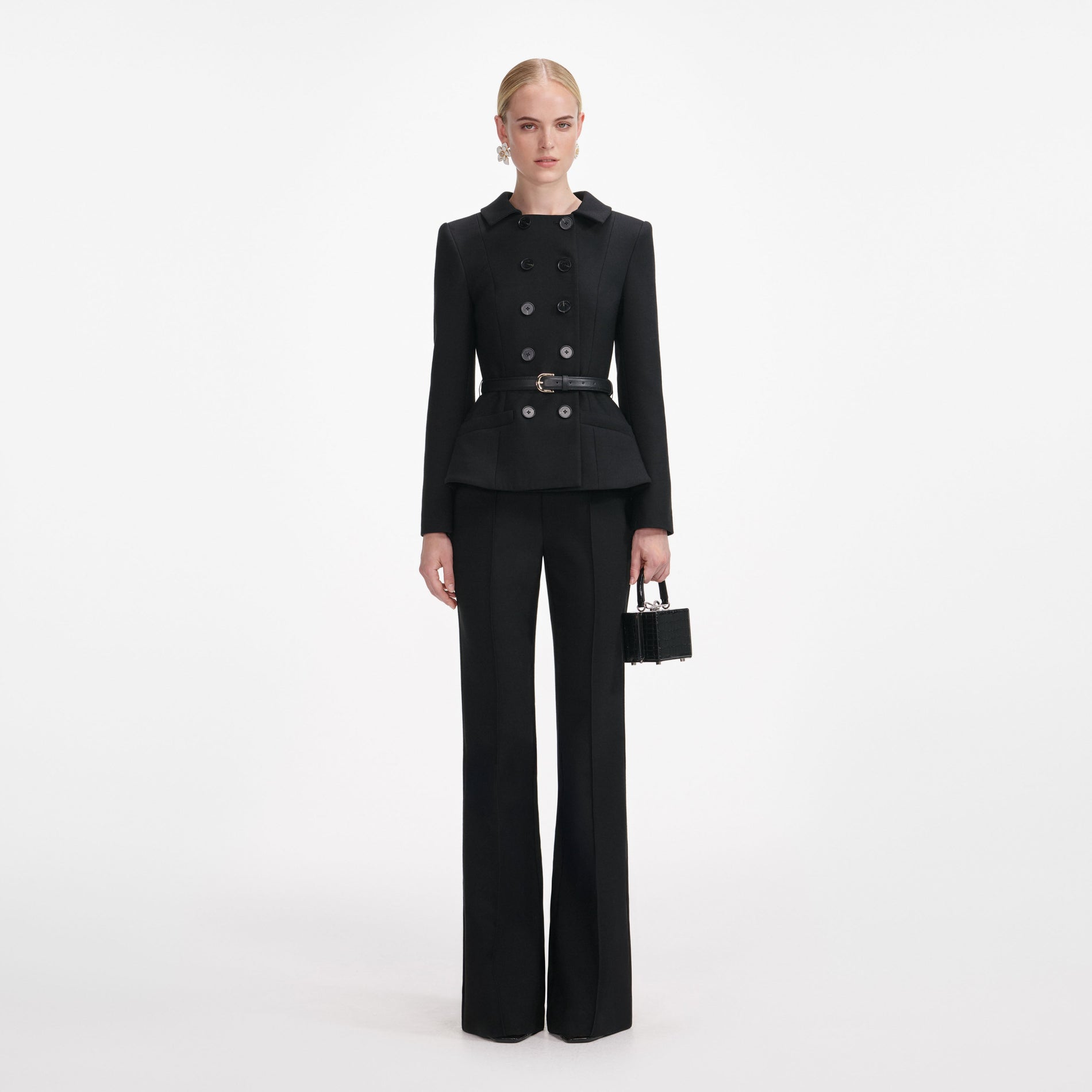 Front view of a woman wearing the Black Wool Double Breasted Jumpsuit