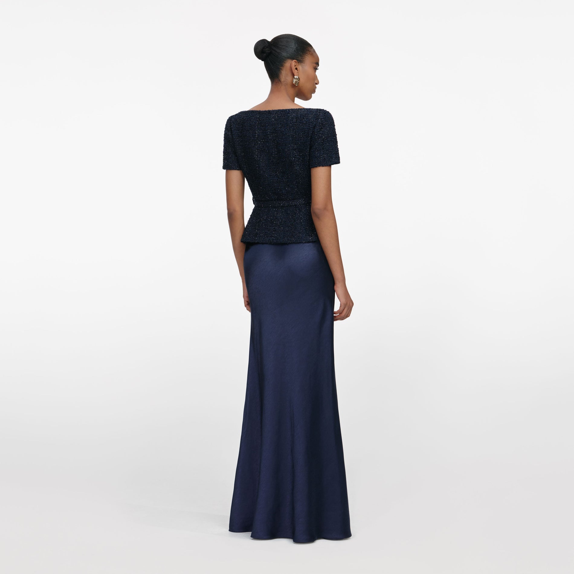 Back view of a woman wearing the Navy Boucle Tailored Maxi Dress