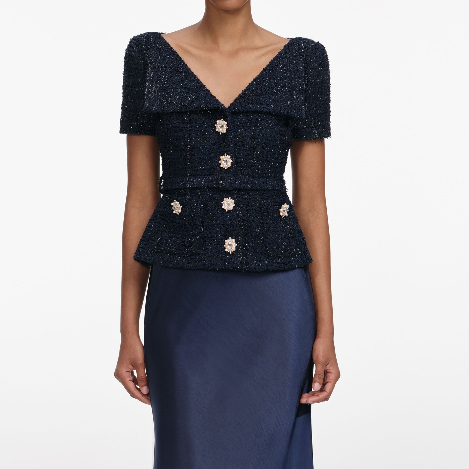 A close up of a woman wearing the Navy Boucle Tailored Maxi Dress
