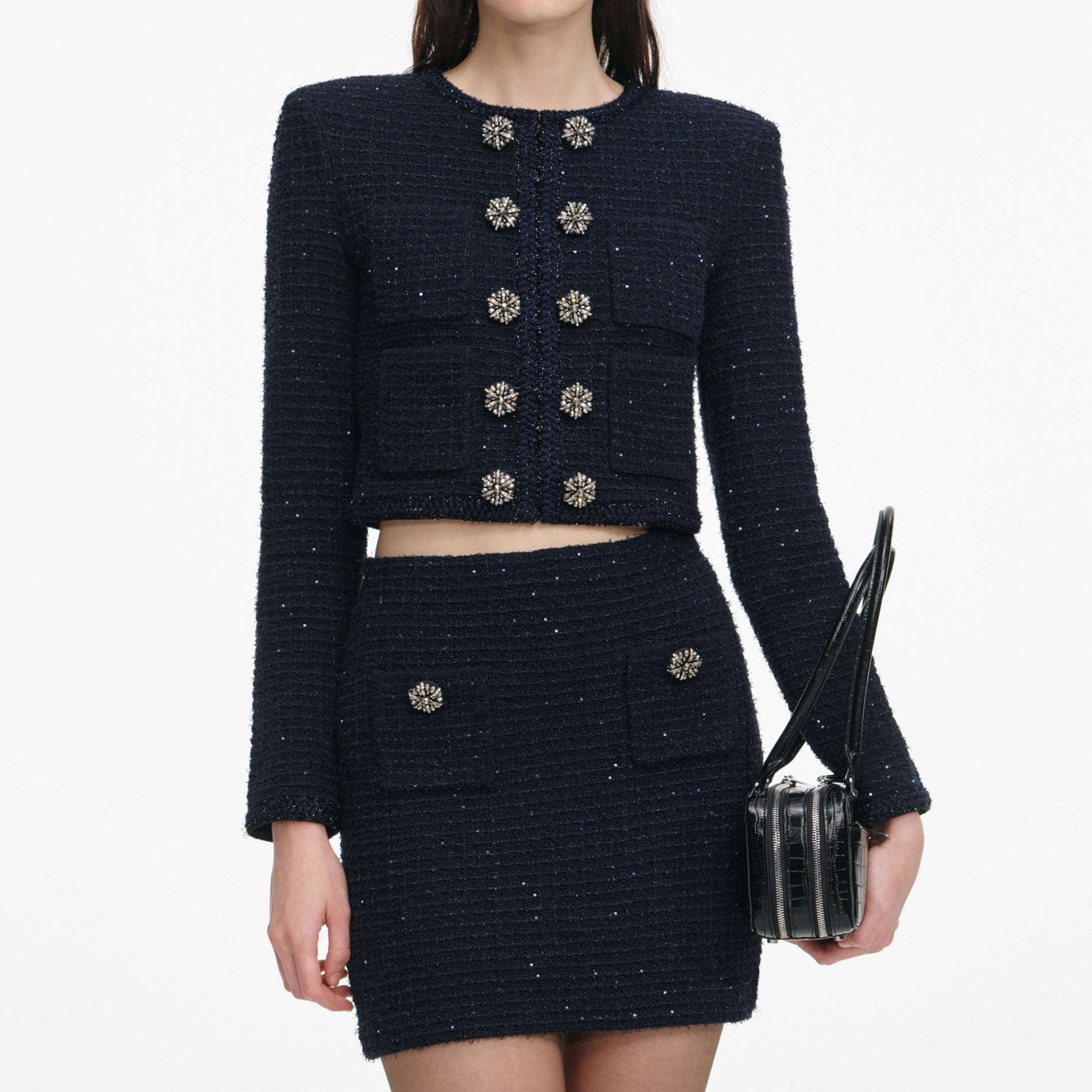 A close up of a woman wearing the Navy Textured Knit Cardigan