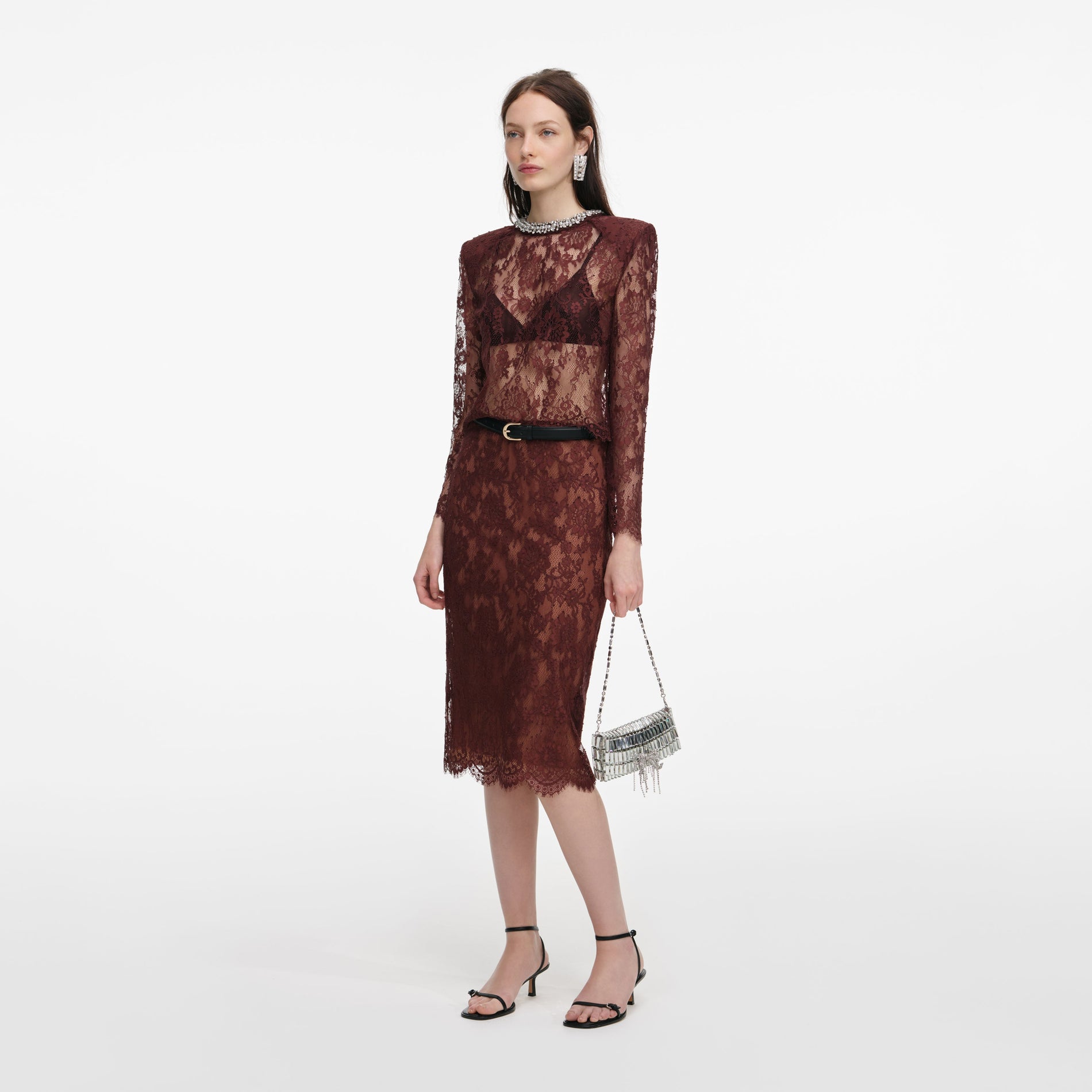 Side view of a woman wearing the Brown Floral Lace Top