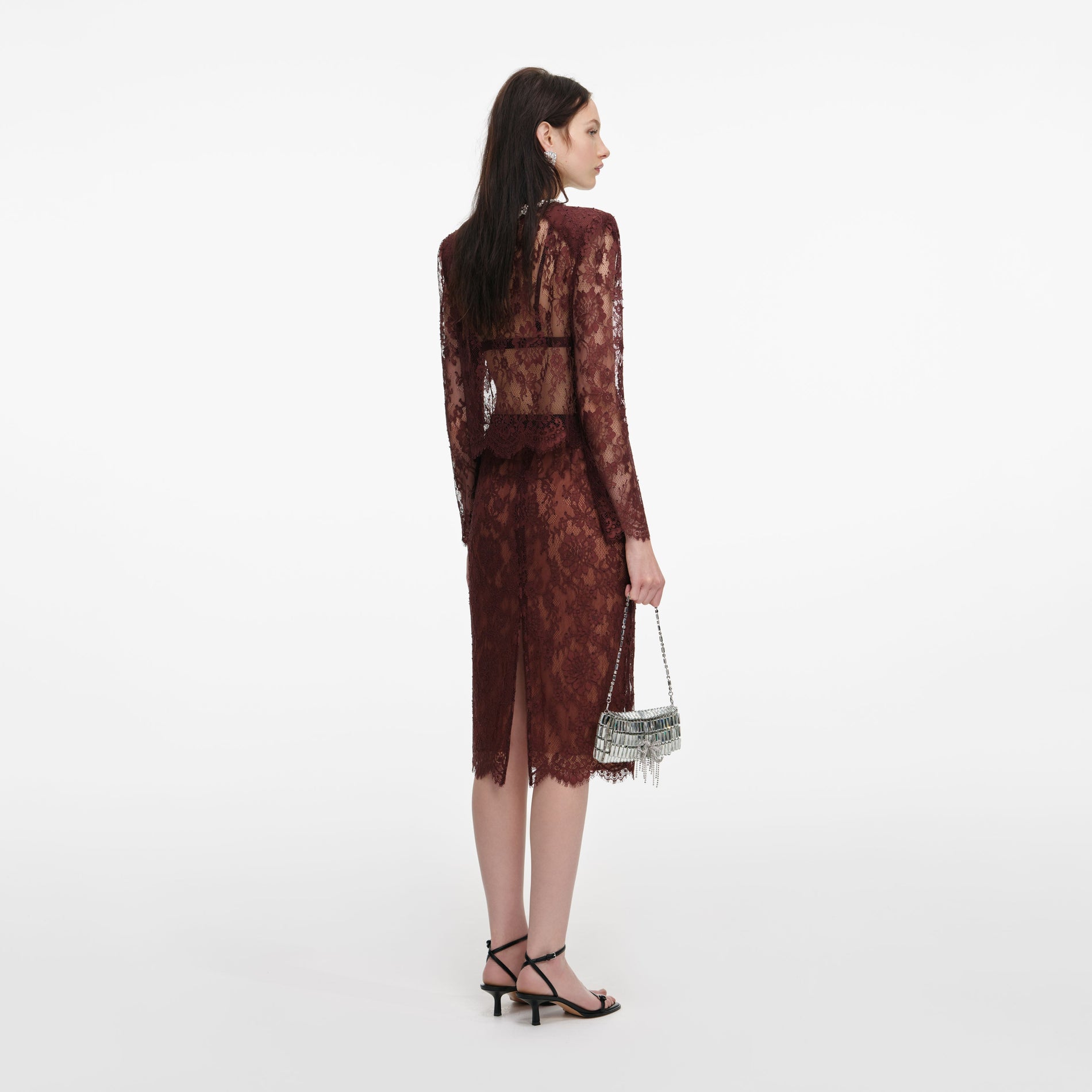 Back view of a woman wearing the Brown Floral Lace Top