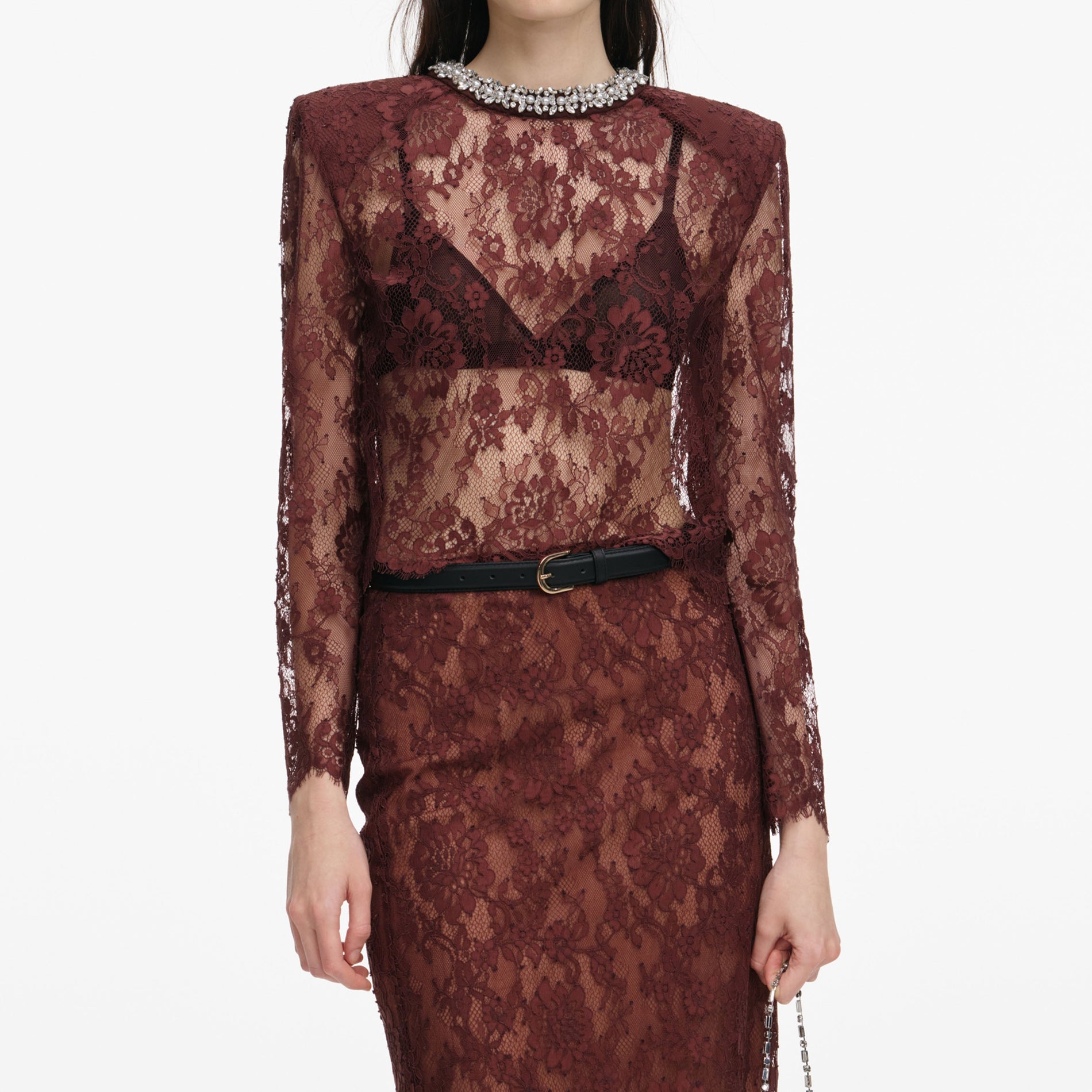 A close up of a woman wearing the Brown Floral Lace Top