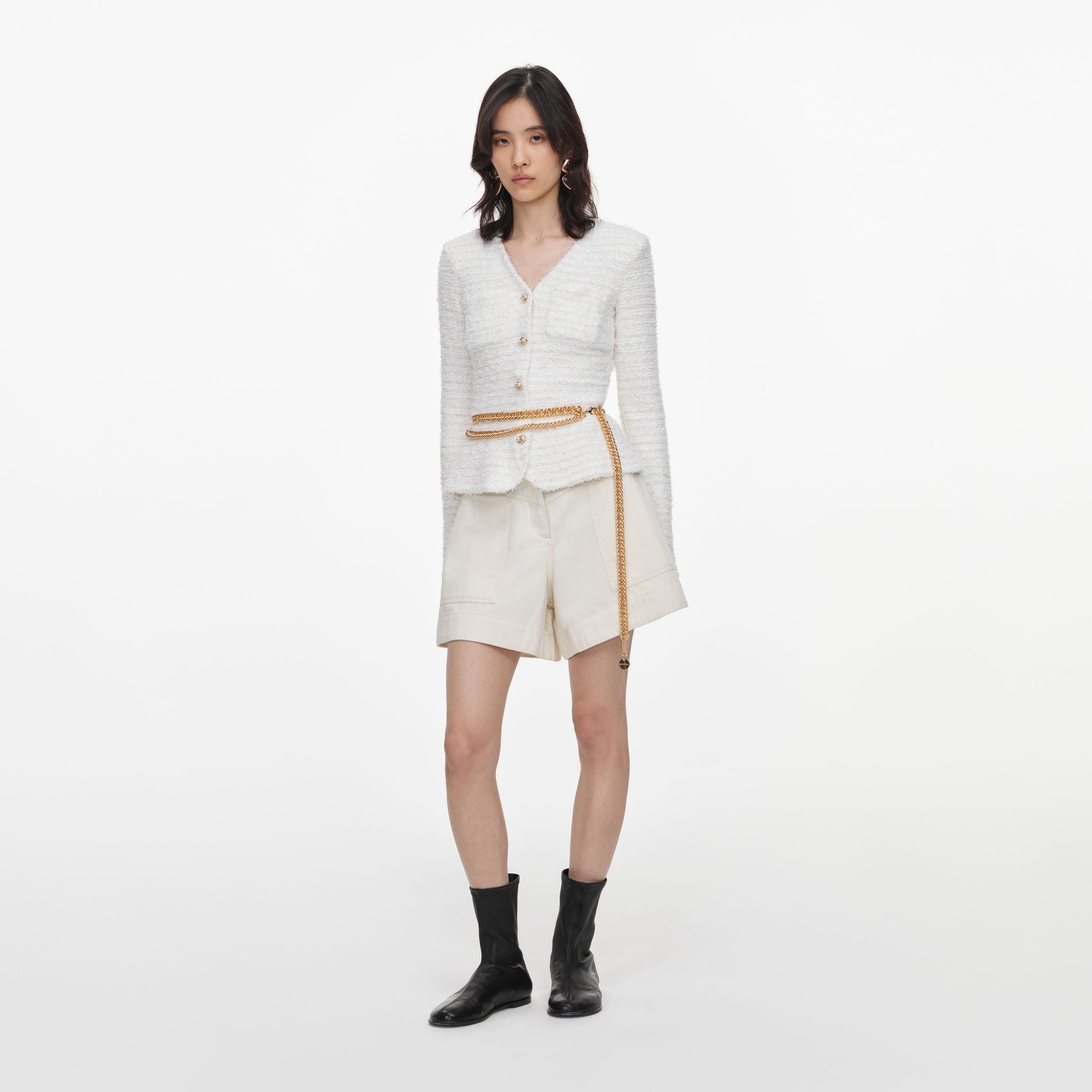 Side view of a woman wearing the Cream Textured Knit Cardigan