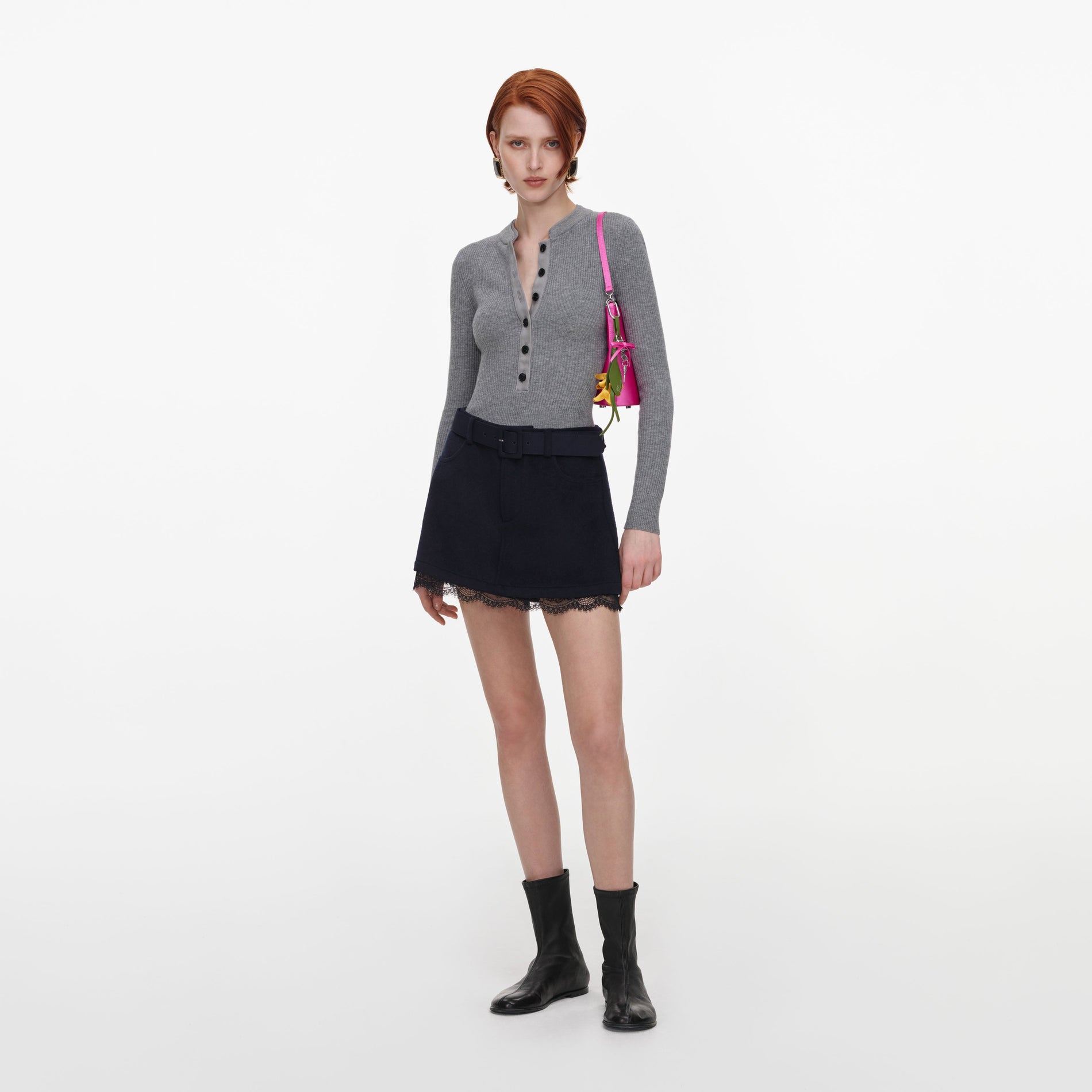 Side view of a woman wearing the Navy Wool Lace Skort