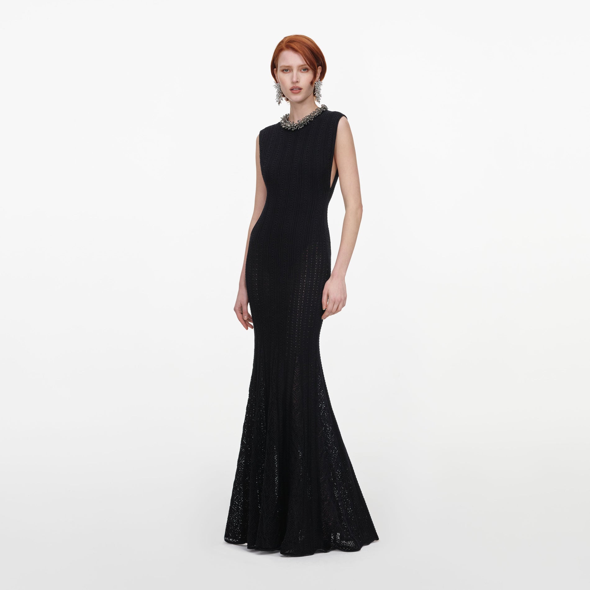 Side view of a woman wearing the Black Beaded Pointelle Knit Maxi Dress