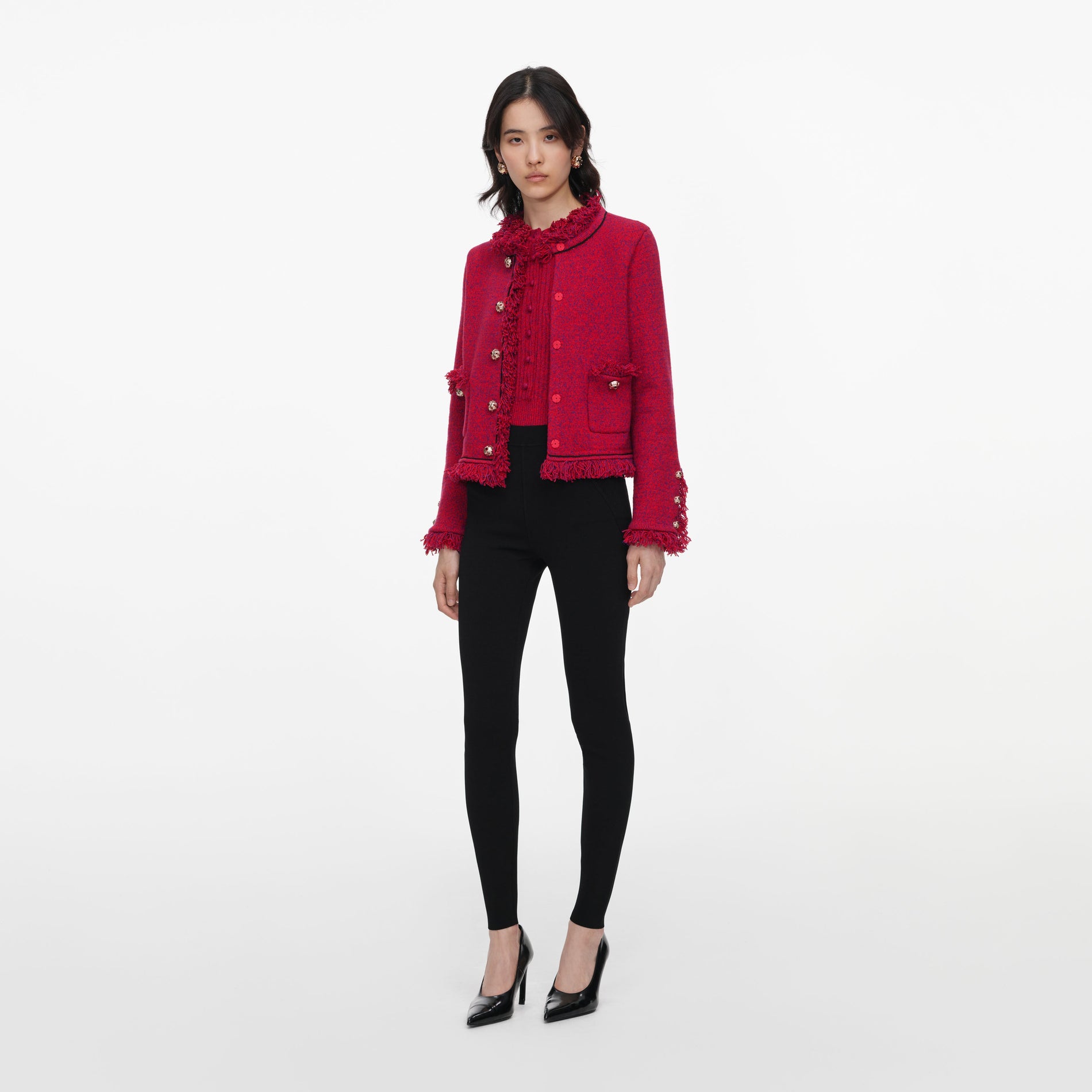 Side view of a woman wearing the Red Frayed Knit Jacket