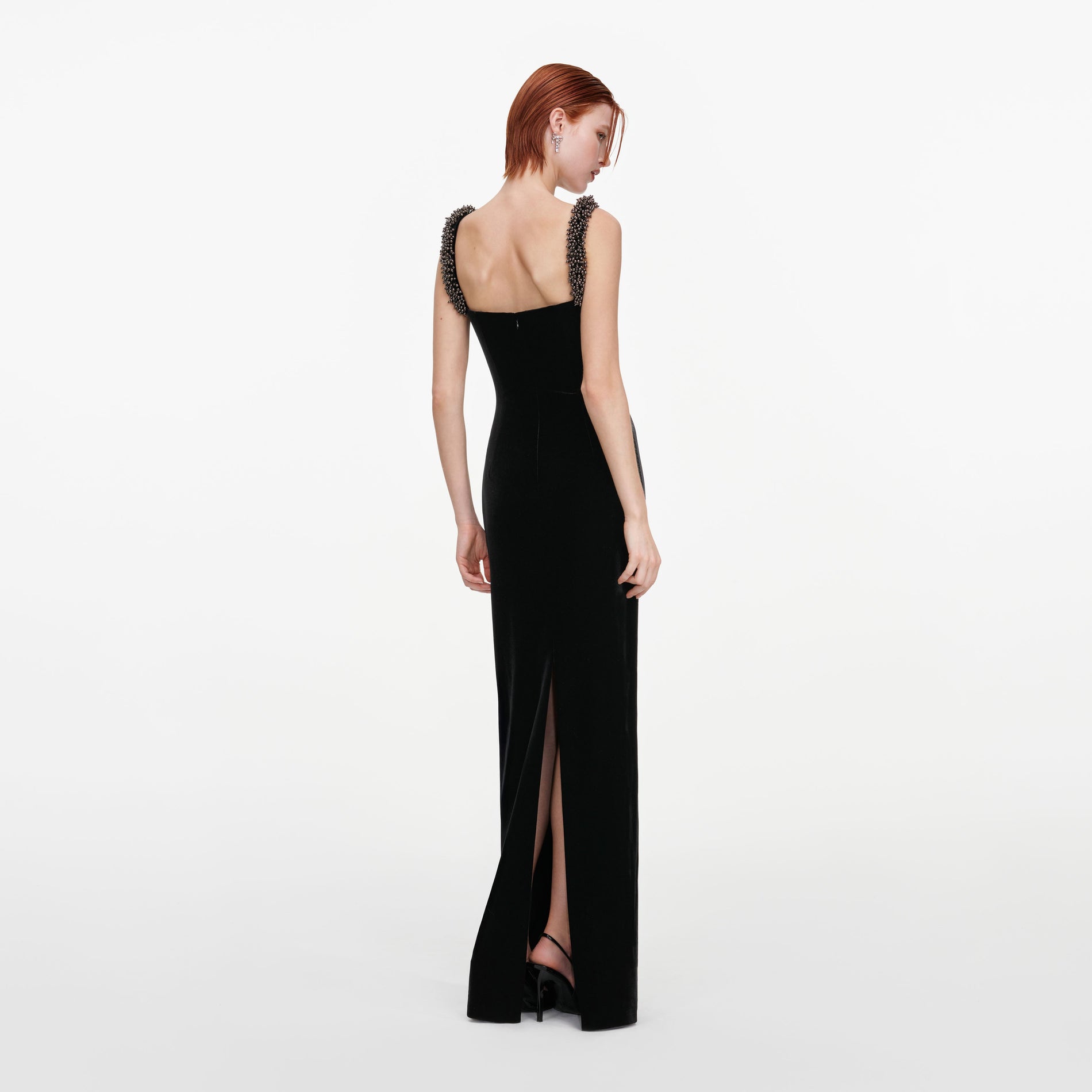 Back view of a woman wearing the Black Velvet Square Neck Maxi Dress