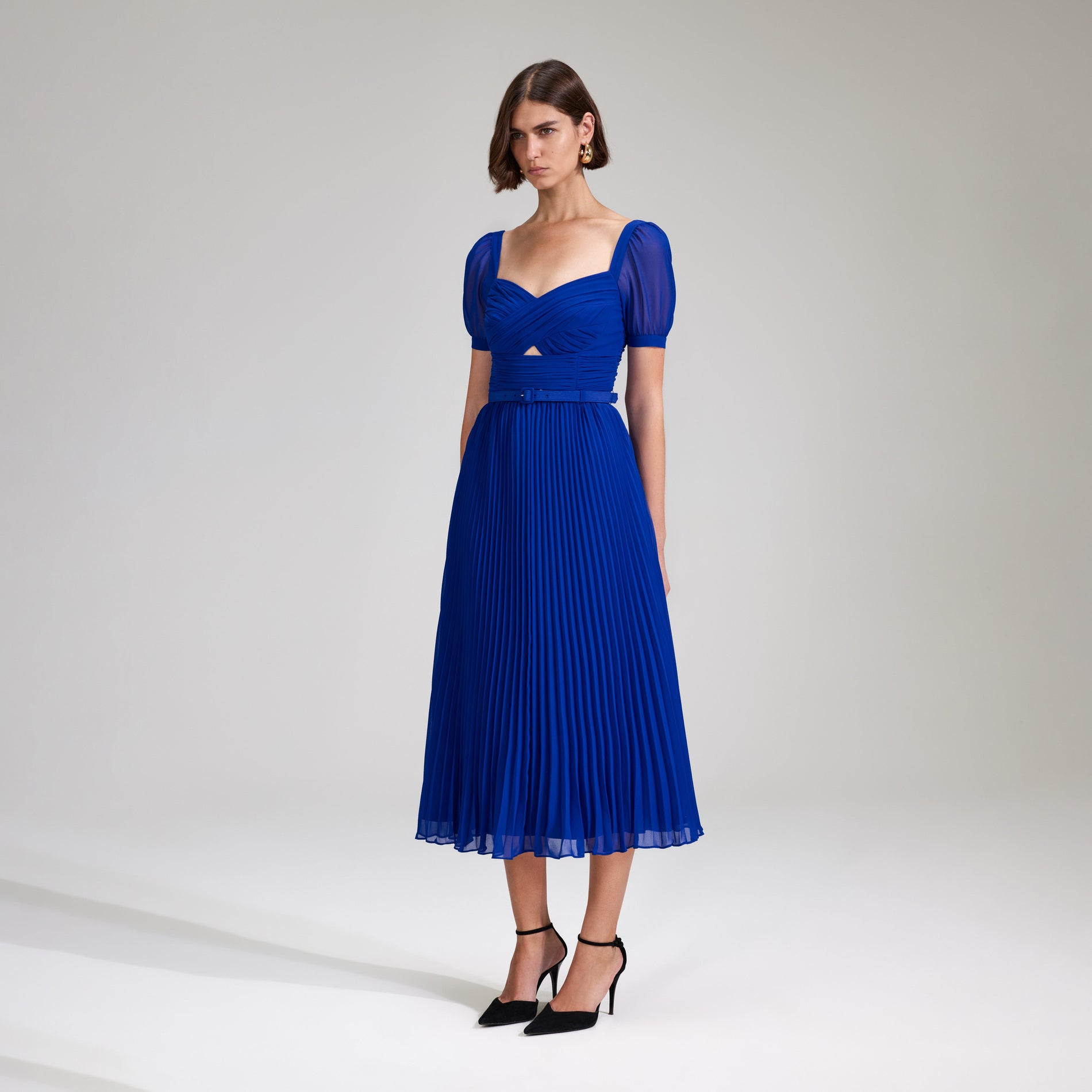 A woman wearing the Cobalt Chiffon Midi Dress