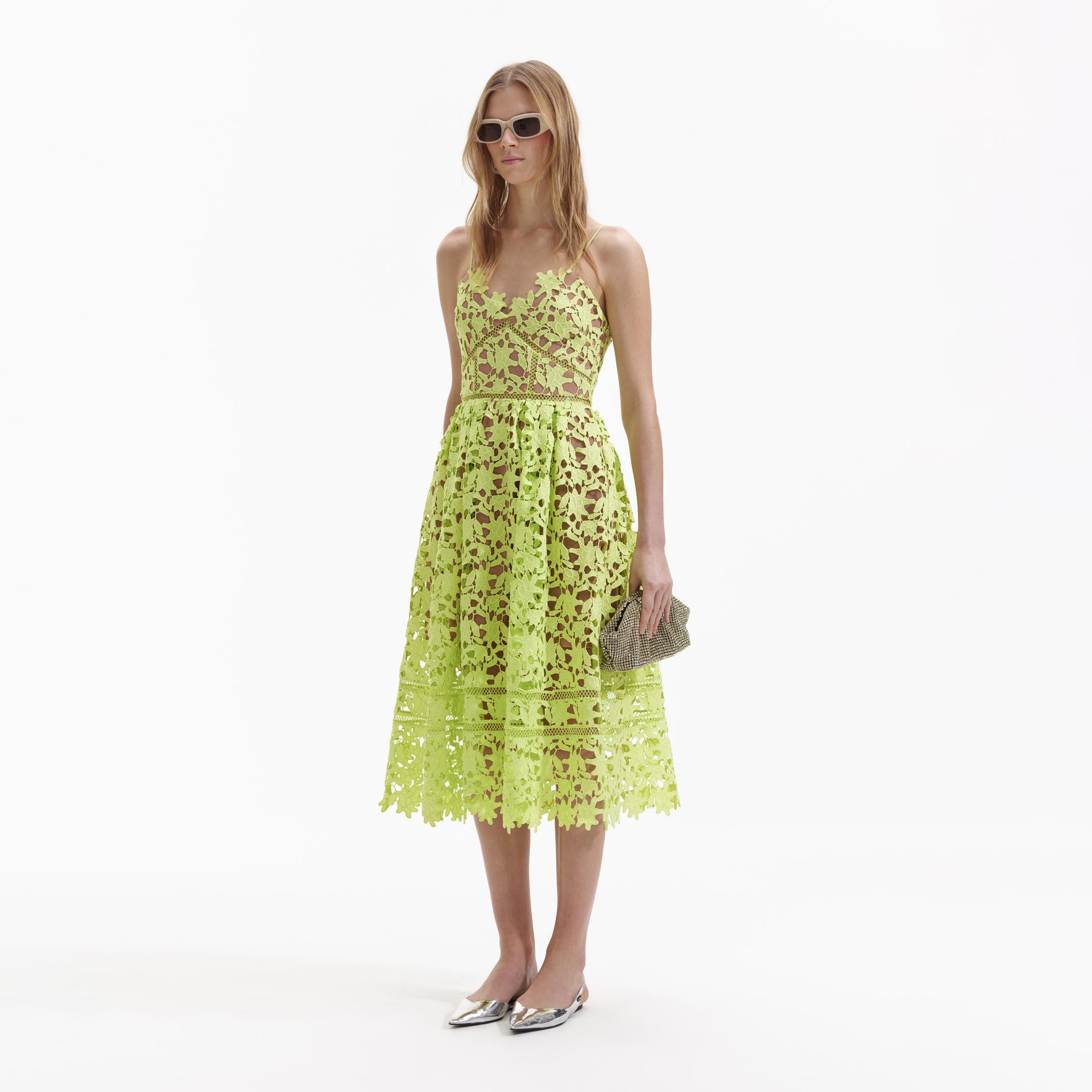 Side view of a woman wearing the Lime Azaelea Lace Midi Dress