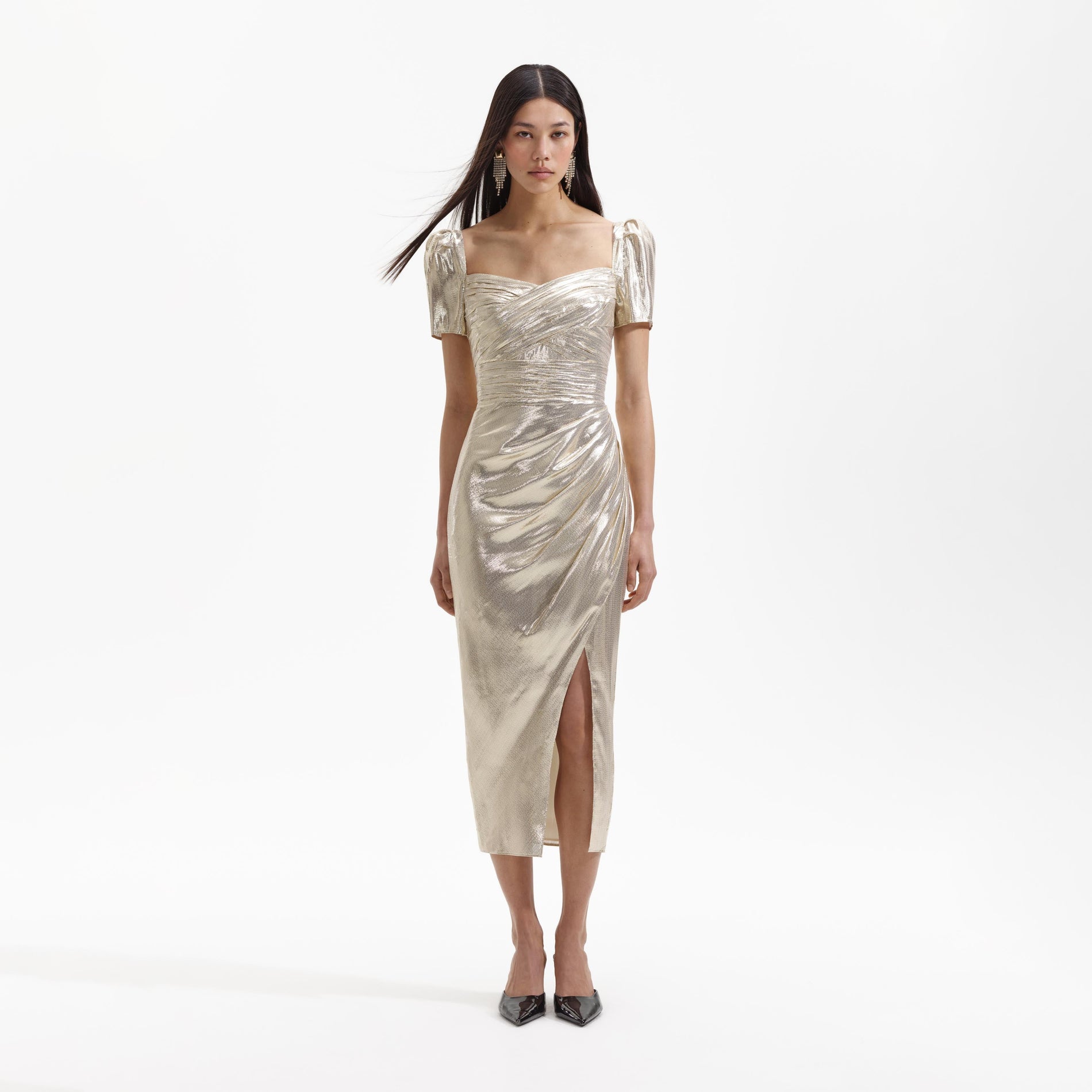 A Woman wearing the Gold Metallic Midi Dress